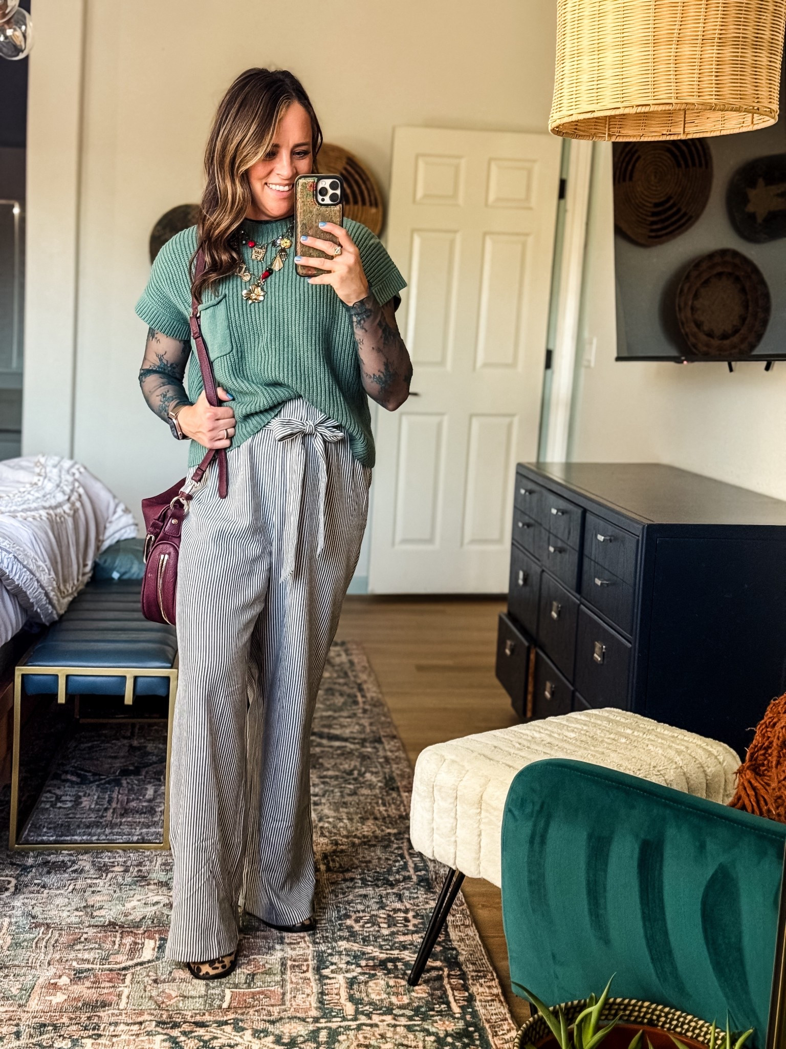 One of those outfits that just feels like me.
Striped paperbag pants + a soft green knit layered over lace, finished with leopard flats and a burgundy bag for a little fun. Comfortable, office-appropriate, and not boring — exactly how I like my workwear.

Wearing S in the top and pants, M in the lace top, normal 6 in shoes 



#LTKOver40 #LTKWorkwear #LTKootd