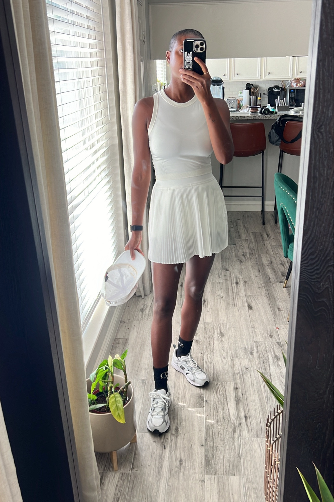 Workout outfit under $45! White seamless  cropped tank, white pleated tennis skirt with built in shorts and new balance 504 sneakers  

#LTKFindsUnder50 #LTKFitness #LTKShoeCrush