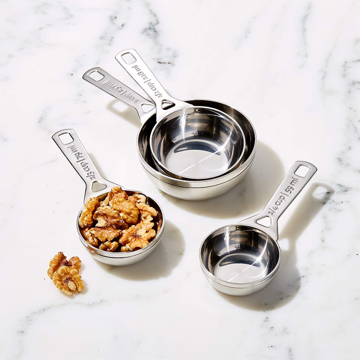 Le Creuset 4-Piece Stainless Steel Dry Measuring Cup Set + Reviews | Crate & Barrel | Crate & Barrel