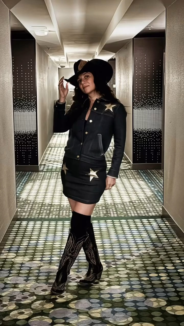 🎠 NFR Review - Outfit #1 🎠
Bringing the golden hour glow to Vegas with this western-meets-70s-inspired look! ✨ Denim dreams paired with golden leather stars for that perfect vintage vibe. Styled with my favorite tall Casanova boots, classic knee highs, and a Stetson topped with a custom feather for that touch of personality. @stoned_immaculate_ always delivers on that small-batch magic. 🪩

Feeling bold, timeless, and perfect for a night under the arena lights. 🌟

Skirt S | Jacket S | Boots 7

IG:
Jewelry @thepirateandthegypsyjewelry

#NFRStyle #WesternFashion #70sInspired #StonedImmaculate #CasanovaBoots #VintageWestern #GoldRushVibes #DenimAndLeather #StetsonStyle #VegasRodeo #WesternOutfitInspo

#LTKOver40 #LTKSaleAlert #LTKGiftGuide