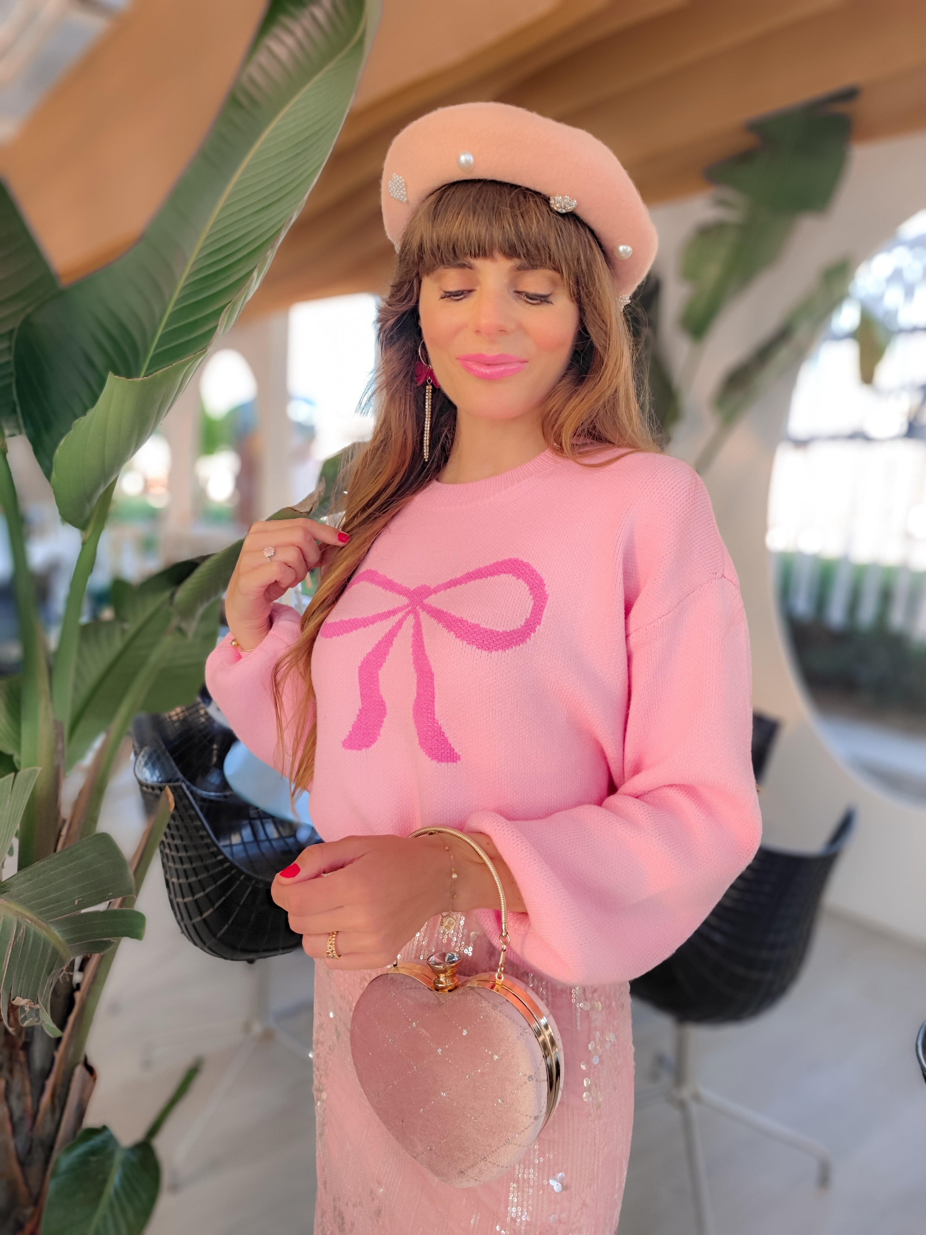 How cute is this pink bow sweater? It will be the perfect cozy piece to add some fun to those early fall looks 💞💖💫Pink sweater, Pink jumper, Pink bow sweaters,  Fall sweaters, Fall fashion, Fall outfits, Pink outfits, All pink outfits, Chicwish sweater, Sequin Pink skirt, Cinderella shoes, Pink beret, bow earrings, hearts shaped clutch.

#LTKStyleTip #LTKSeasonal #LTKFindsUnder50