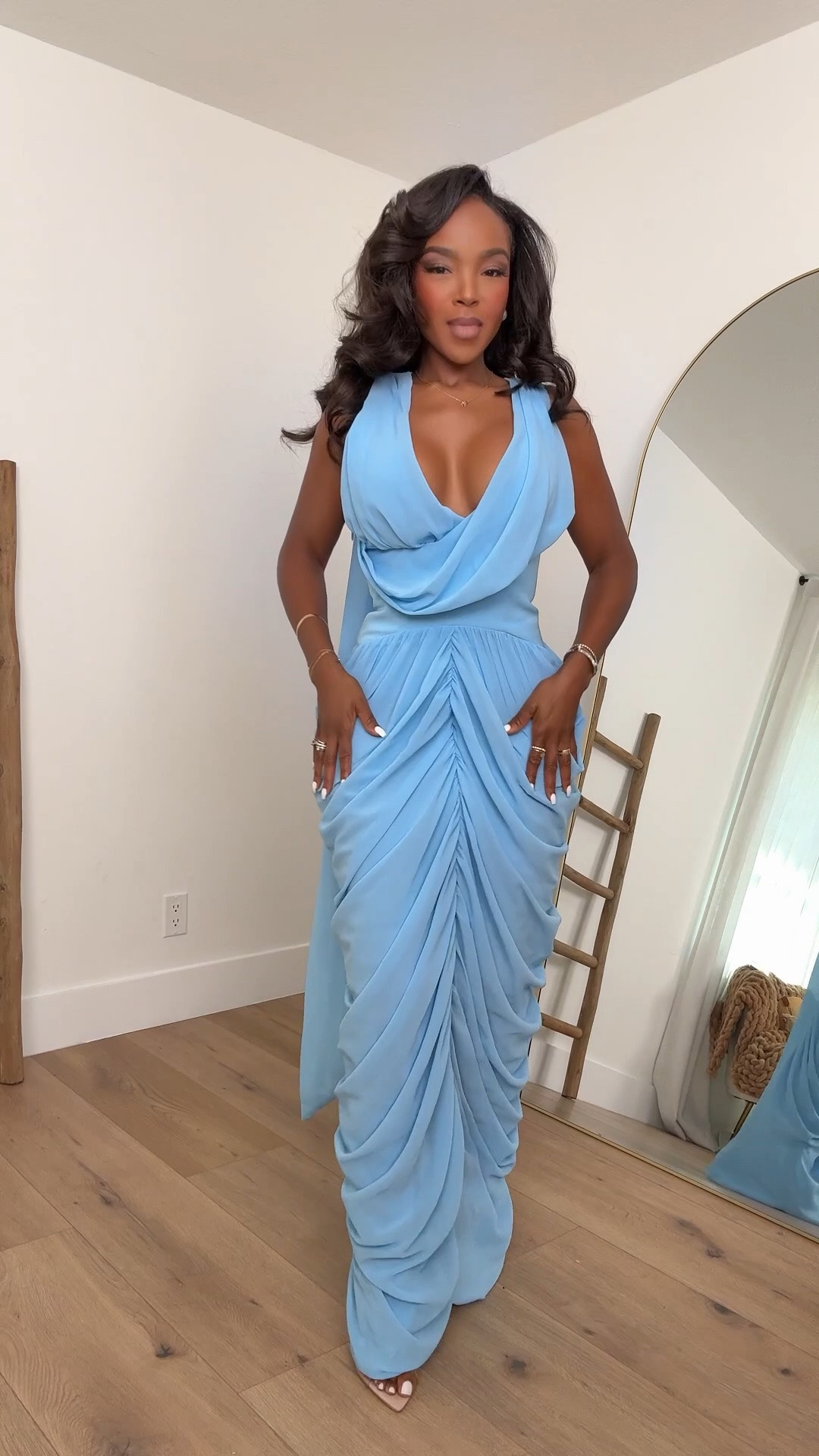 Hi Babes!

This powder blue gown is absolutely stunning. The draped neckline, gathered detailing, and flowing silhouette create such a romantic, feminine look that feels straight out of a luxury event. The soft blue shade is incredibly flattering and gives the entire outfit an elegant, timeless feel.

This is one of those dresses that makes you feel instantly glamorous the moment you put it on. The ruching creates beautiful shape while the flowing fabric adds movement that's gorgeous in both photos and videos.

Where to wear this:
• Wedding guest
• Formal events
• Gala evenings
• Engagement party
• Baby shower
• Bridal shower
• Vacation dinner
• Special celebrations

Undergarments: Nude seamless underwear and adhesive cups or a plunge bra work best with the draped neckline.

Everything is linked below.

xx Kira | IG: KirasFashionFinds

34D - 27 - 40 • Size Small or 4

Follow me on Instagram and YouTube @kirasfashionfinds