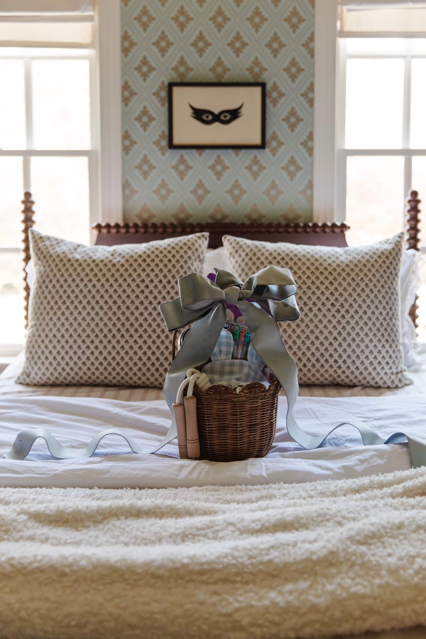 Every year, I love putting together a sweet basket of goodies for my girls to celebrate Easter. This year, it kind of snuck up on me as Easter is the Sunday after spring break, and we planned a trip over that week. Hopefully I can have their baskets ready, so we can walk into the house on Easter and delight them with treats!

Faye’s room, wallpaper, eye mask art, CLJ x PBK turned wood bed, Easter basket, eye mask, jump rope, smencils 