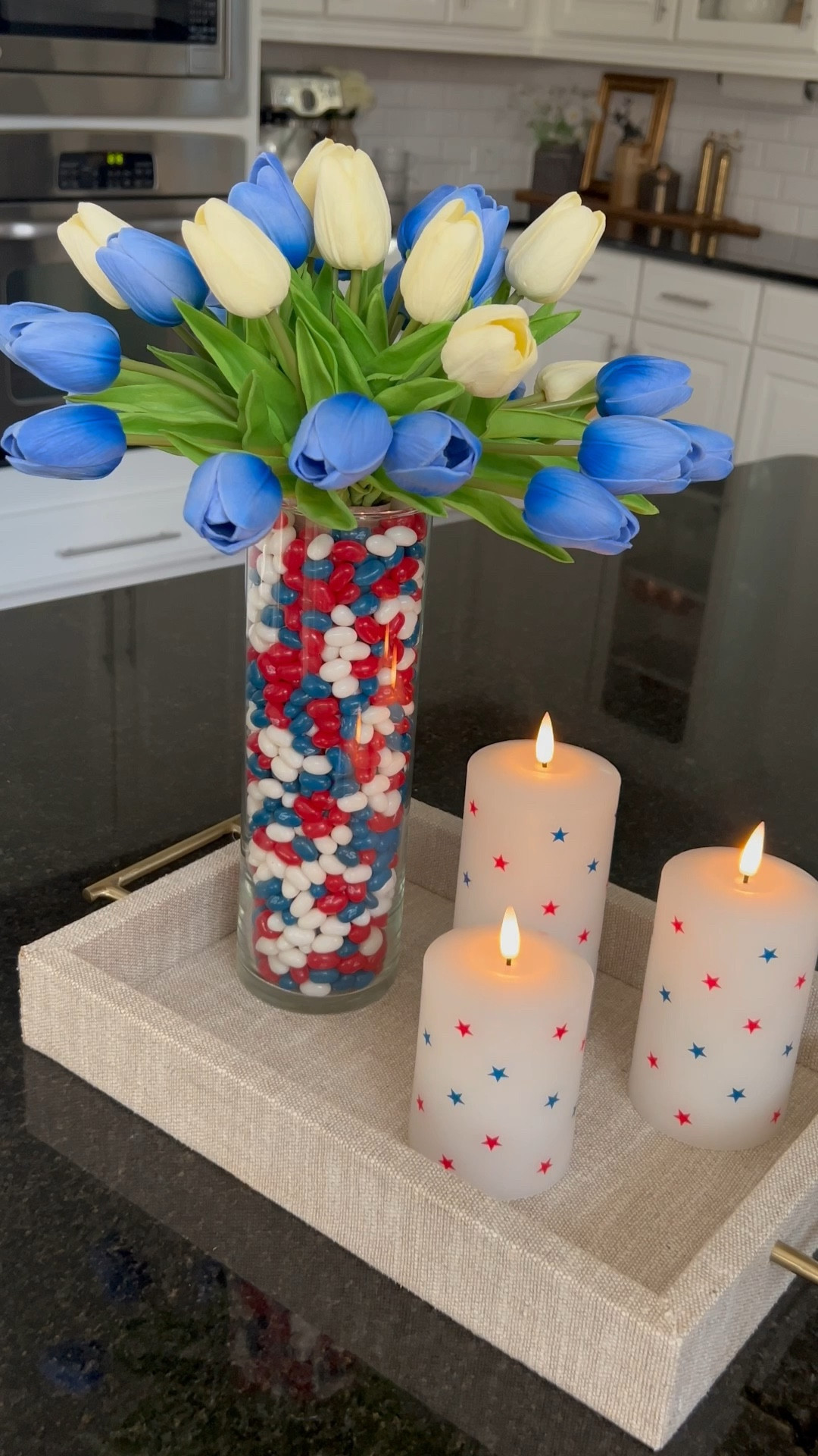 Red blue white decor #july4 #july4th #redbluewhite #vase #afforfablevase #affordabledecor #centerpiece #july4centerpiece #amazonfind #faux #fauxtulips #candles #flameless #bluetulips #whitetulips 

#LTKFindsUnder100 #LTKFindsUnder50 #LTKHome