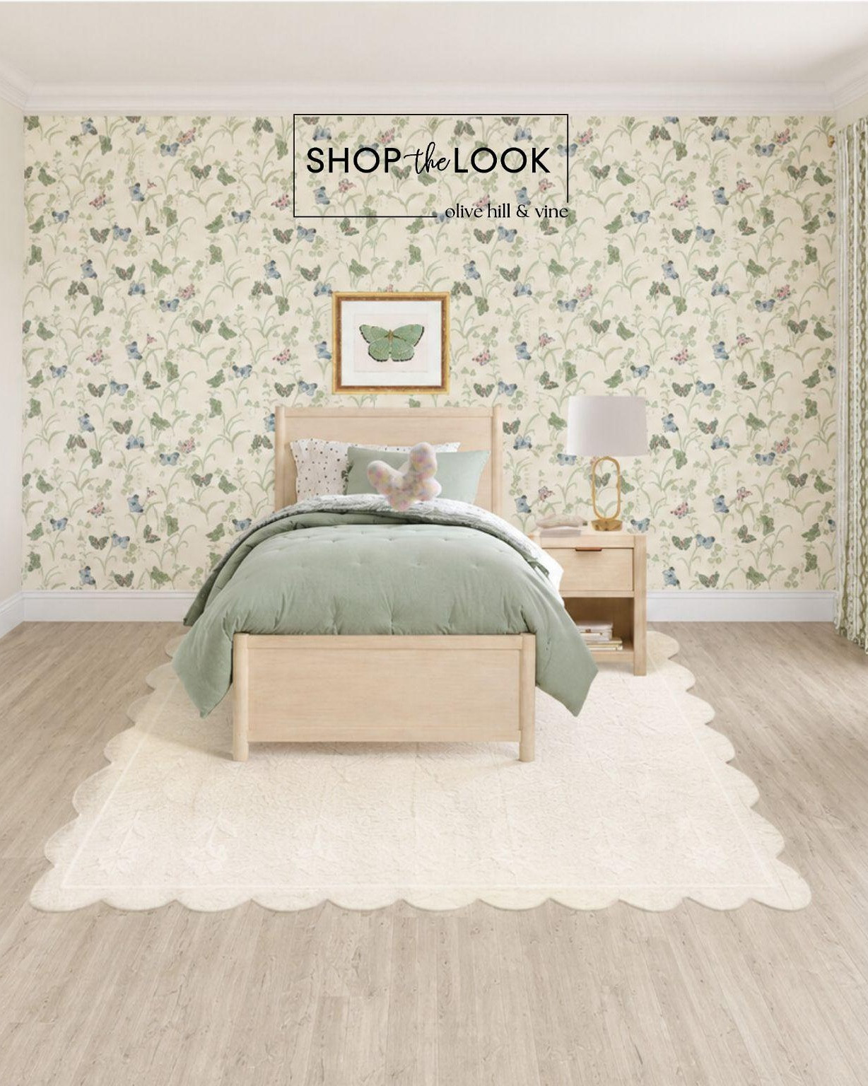Soft green layers meet delicate butterfly wallpaper for a space that feels light, fresh, and quietly magical. Warm wood tones and a scalloped rug ground the room, while subtle accents keep it sweet, airy, and effortlessly pulled together.

#LTKHome #LTKKids