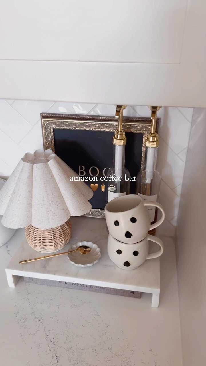 amazon coffee bar with a side of seasonal touches 🤭☕️✨ | this marble tray is so good I bought it twice, the mini rattan lamp + shade combo is chefs kiss in this corner (thanks @a.house.of.daisies 🫶🏼) + my fave syrup bottles are currently 20% off (clip the coupon) 

save + share for a cute coffee bar set up! 🧋
#amazon #amazonhome #amazonfinds #coffeetime #coffeebar #countertopdecor #halloweendecor #halloweenhome #spookyseason #coffeetime 

#LTKHalloween #LTKHome #LTKSeasonal