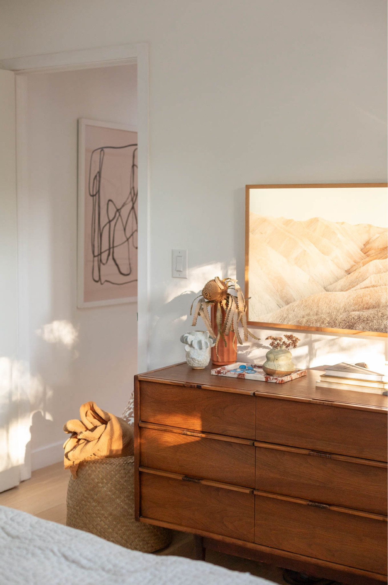 Sunlight coming through in the guest bedroom this morning. 🌞🤗 abstract artwork prints - dresser - frame tv - woven basket - red marble tray - Amazon finds 

#LTKhome #LTKSeasonal