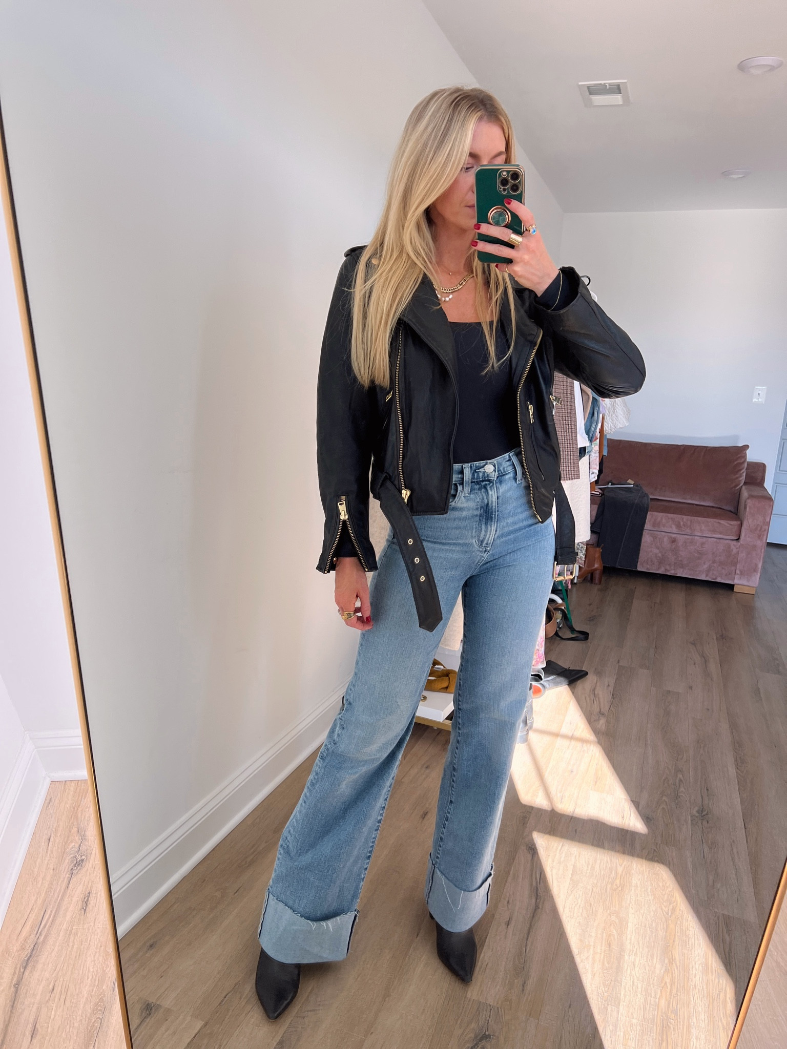 Black leather biker jacket, wide leg denim, black soft bodysuit (wearing a small), black boots. #ltkfind 

#LTKstyletip #LTKfindsunder100