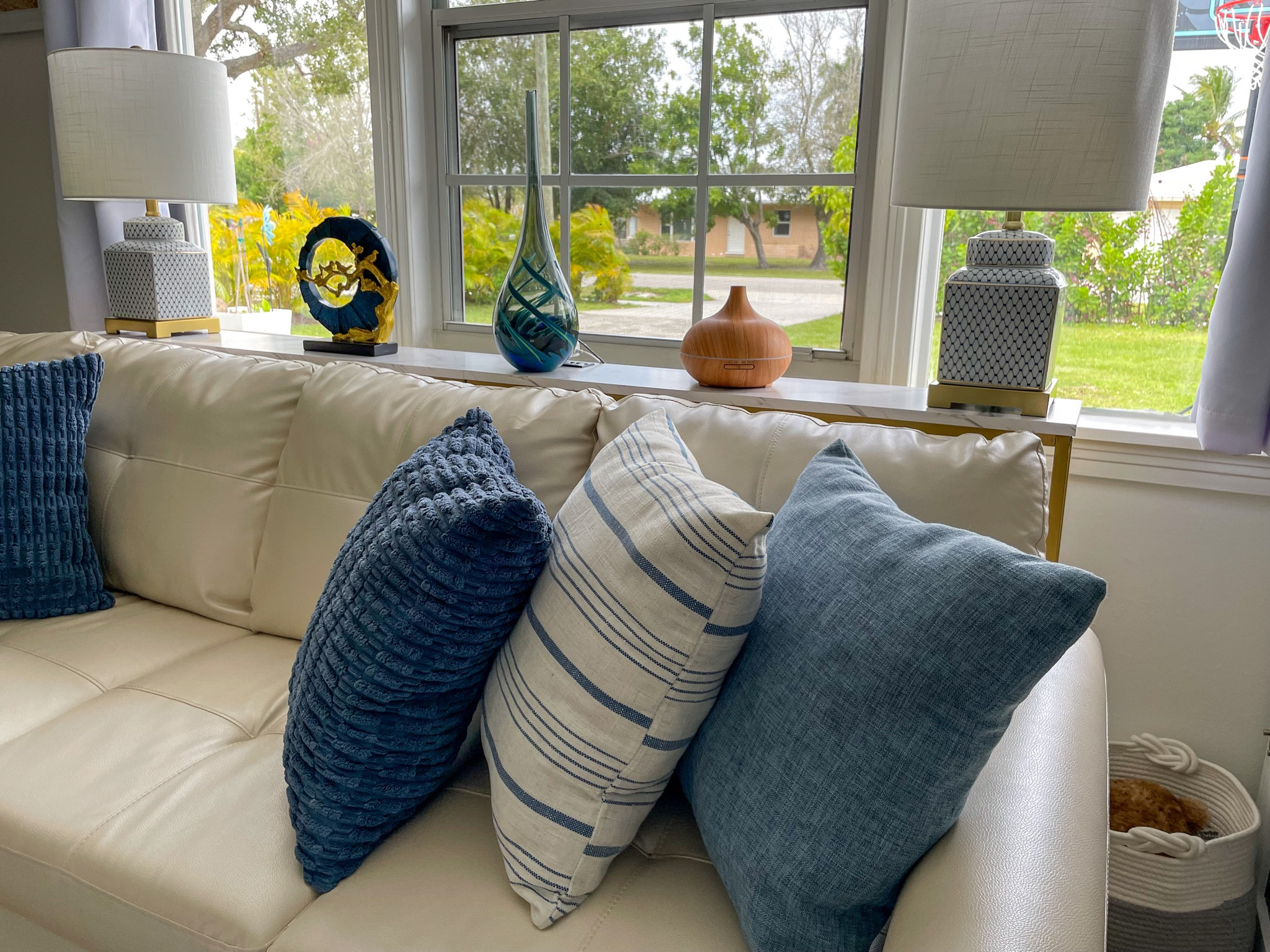 Skinny tall table behind couch provides the perfect spot for the lamps and decor while staying out of the way for an open space design. #founditonamazon #amazonhome 

#LTKhome