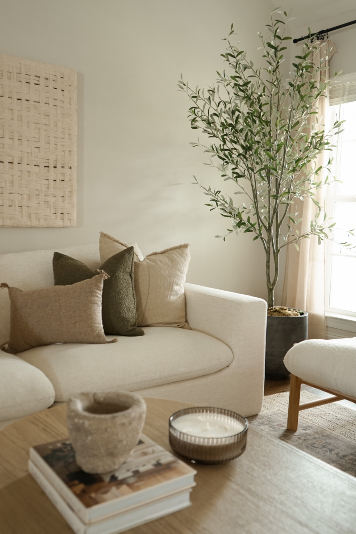 Organic living room
Pillows
Oval Coffee table 
Candles
Olive tree 
Wall art 
Ltk home 

#LTKhome