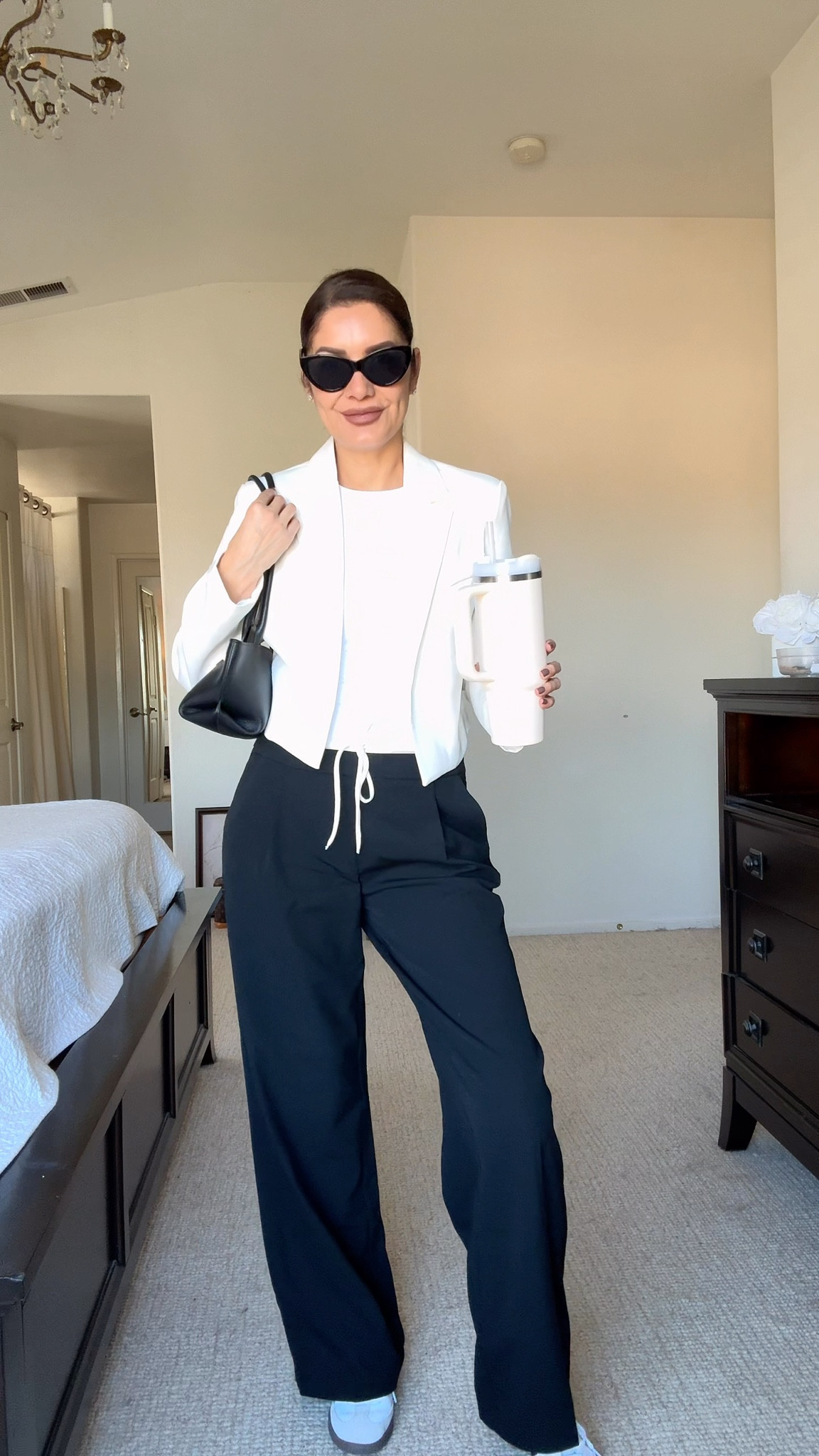 Day 17 of Fall Outfit Ideas
This is a casual and chic outfit.
➡️What I am wearing:
Zara pants size S
Zara white tee size S
Amazon white crop blazer size S
Adidas samba sneakers
Demellier shoulder bag
Sunglasses
.
➡️Here are my body measurements for your reference:
Bra: 32C (81 cm)
Waist:26" (66 cm)
Hips: 38" (96.5 cm)
Height: 5'7" (170 cm)
,

This outfit is one of my go-to looks for casual Fridays at the office. It’s comfortable but still polished enough to look put together for meetings or after-work plans. I also love how easily it transitions from work mode to weekend mode — just swap the shoes or accessories, and you’re ready for a casual gathering with friends. Effortless, chic, and perfect for those “I want to look good but not overdo it” kind of days.
