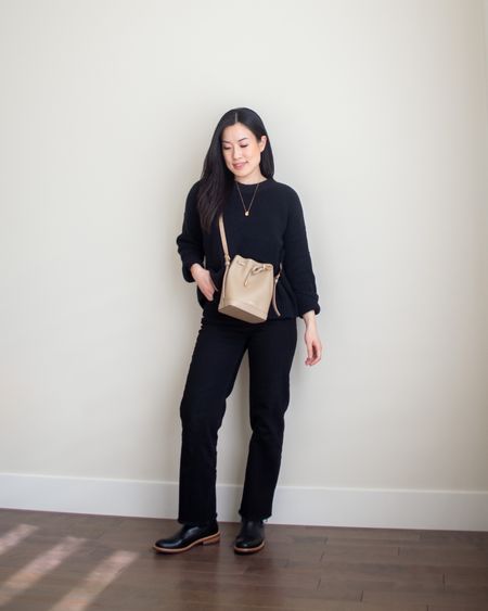 A monochrome black outfit featuring Tradlands sweater XS, Everlane jeans 24. Unavailable to link: Jenny Bird necklace.

#LTKfindsunder100 #LTKSeasonal #LTKstyletip