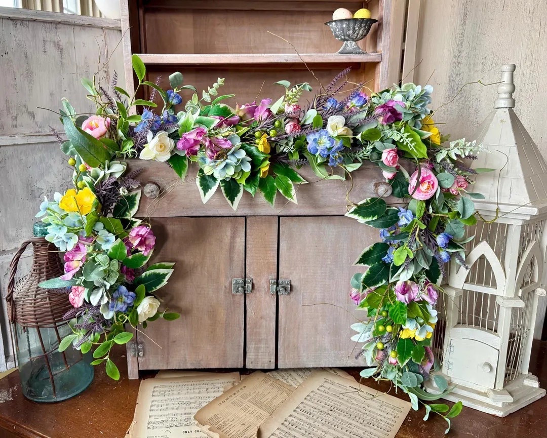 Bring a burst of spring indoors with this whimsical wildflower garland filled with soft pink ranunculus, cheerful apple blossoms, lavender sweet peas, and delicate violas. Lush greenery, berries, and spiraling sticks add natural texture while the flexible wire base makes it easy to drape over mantels, shelves, or doorways. It’s the perfect way to add a romantic garden feel to your home all season long. 🌸🌿 #LTKhome #springdecor #floraldecor #farmhousestyle #wildflowerstyle #seasonaldecor #cottagecore #homedecorfinds

#LTKSeasonal #LTKBump #LTKWedding