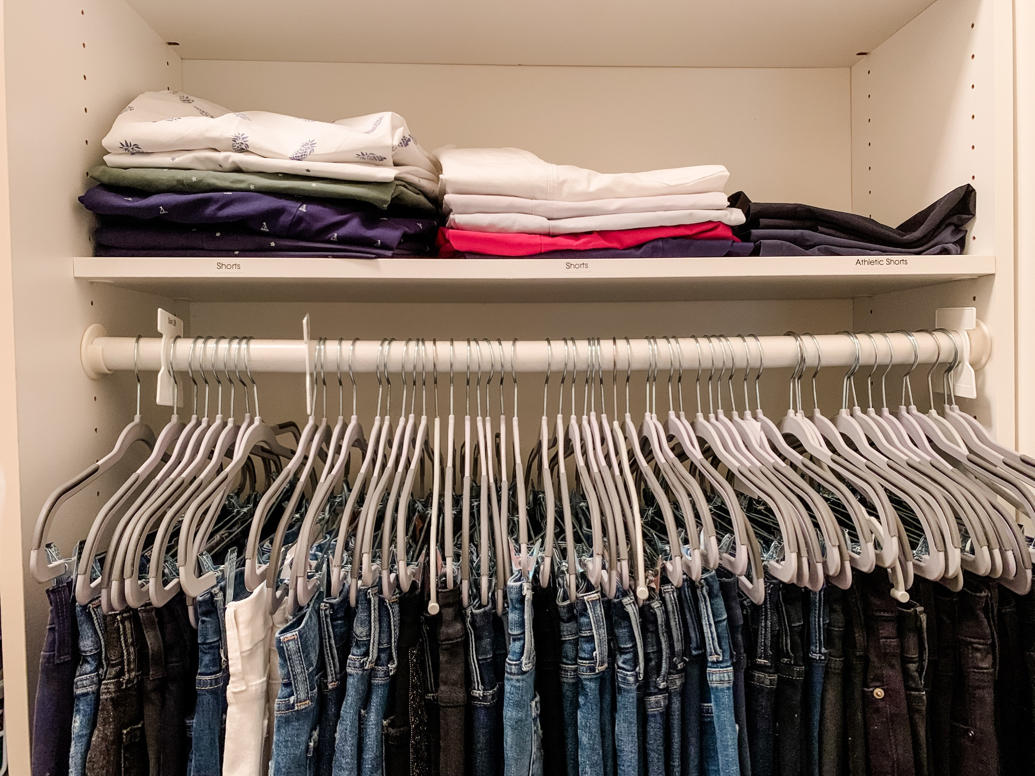 If you’ve got the vertical space, hanging pants with clip hangers keeps them wrinkle free and easy to see!
Also good for skirts and shorts. 

#LTKhome