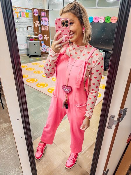 Valentine’s Day outfit 
Valentine’s Day long sleeve 
Heart shirt 
Pink jumpsuit 
Free people dupe 
Valentine’s Day sneakers 

#LTKSeasonal #LTKshoecrush #LTKworkwear