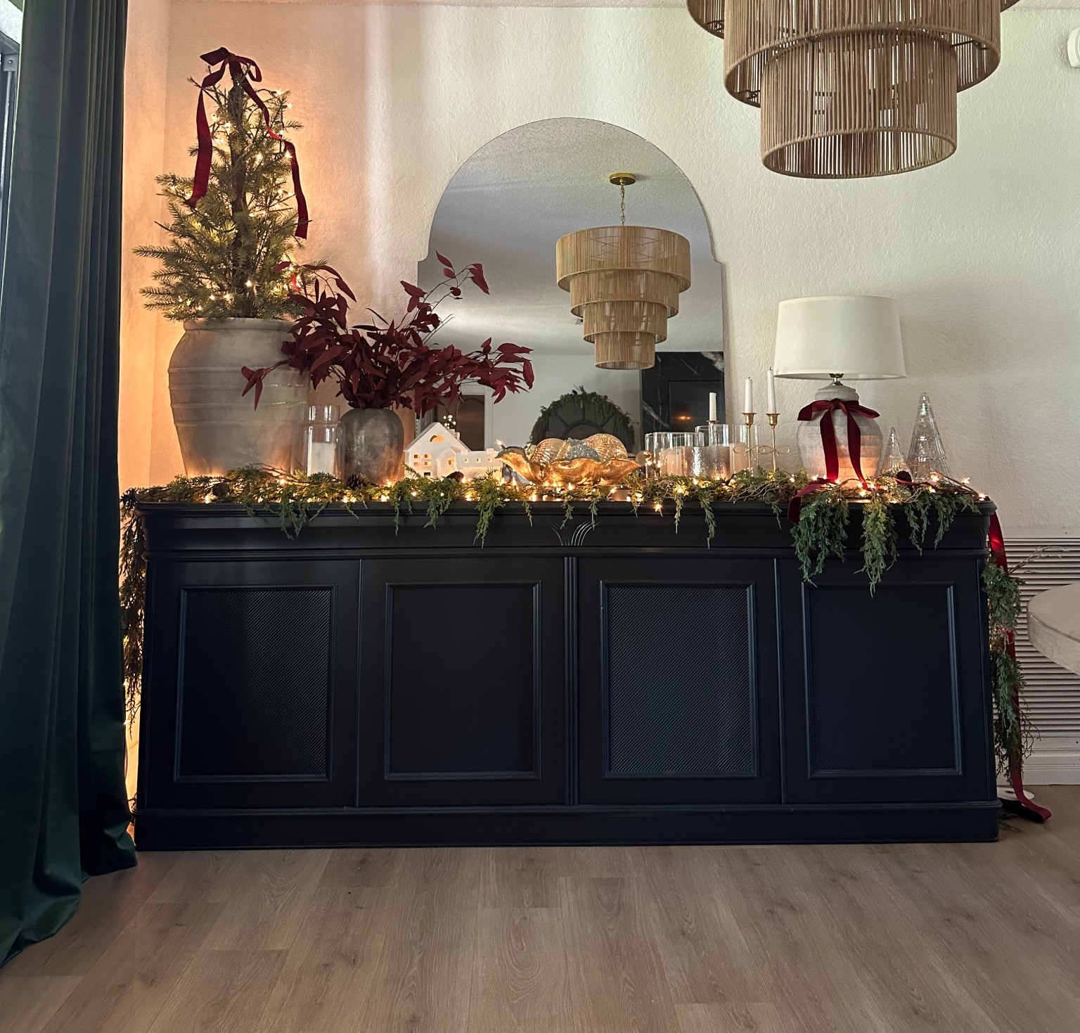 Credenza decorated for Christmas ✨
I added whimsical garland with lights, a mini Christmas tree with a velvet bow I made, little ceramic houses, Christmas trees, and vintage-inspired ornaments. 

festive centerpiece

Credenza 
Buffet cabinet 
Vintage cabinet decor 
Christmas decor
Dining room buffet 
Console table 
Cabinet 
Vintage Christmas 
Mini Christmas tree
Ornaments 
Ralph Lauren Christmas 
Green Christmas 
Pottery barn 
Walmart 
McGee 
Magnolia 
Chandelier 


#LTKHome #LTKHoliday #LTKFindsUnder50