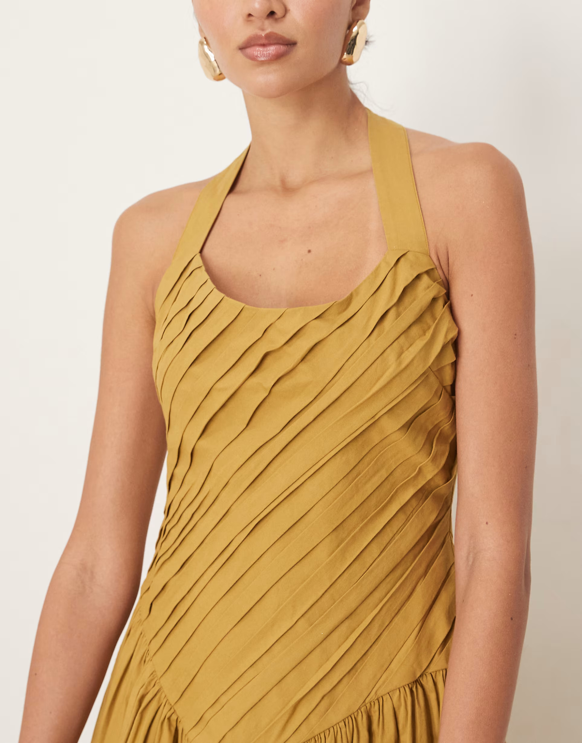 ASOS DESIGN halter neck asymmetric pleat bodice midi dress with dropped waist in turmeric | ASOS | ASOS (Global)