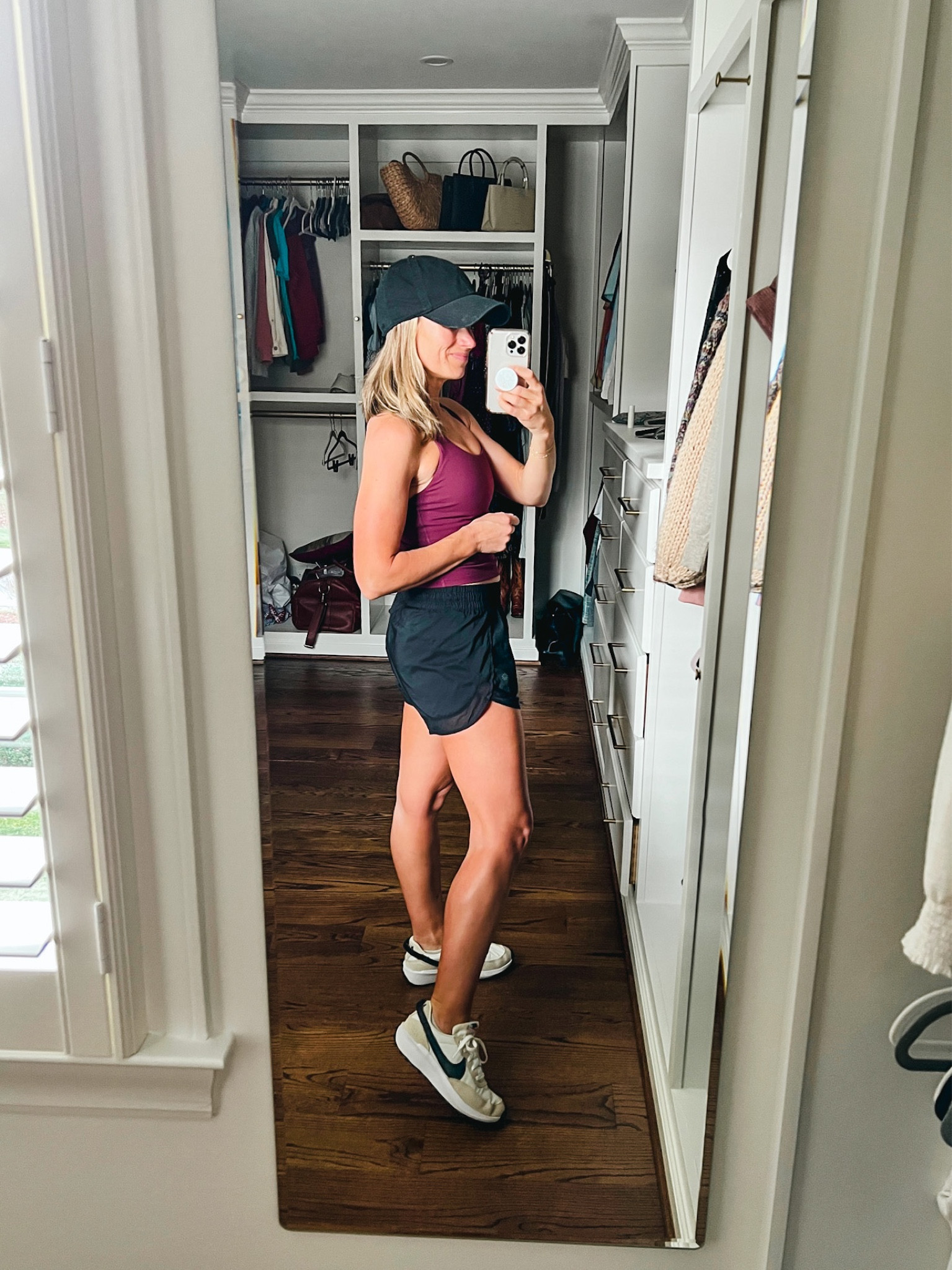 Amazon workout top (wearing a Small), Athleta running shorts (wearing an XS), Nike Waffle Debut sneakers in a 7 (a few colors left), and an Amazon ball cap. #workoutclothes #amazonworkoutclothes #amazonfinds #amazonfashion #LTKunder50 #LTKFind #LTKfit