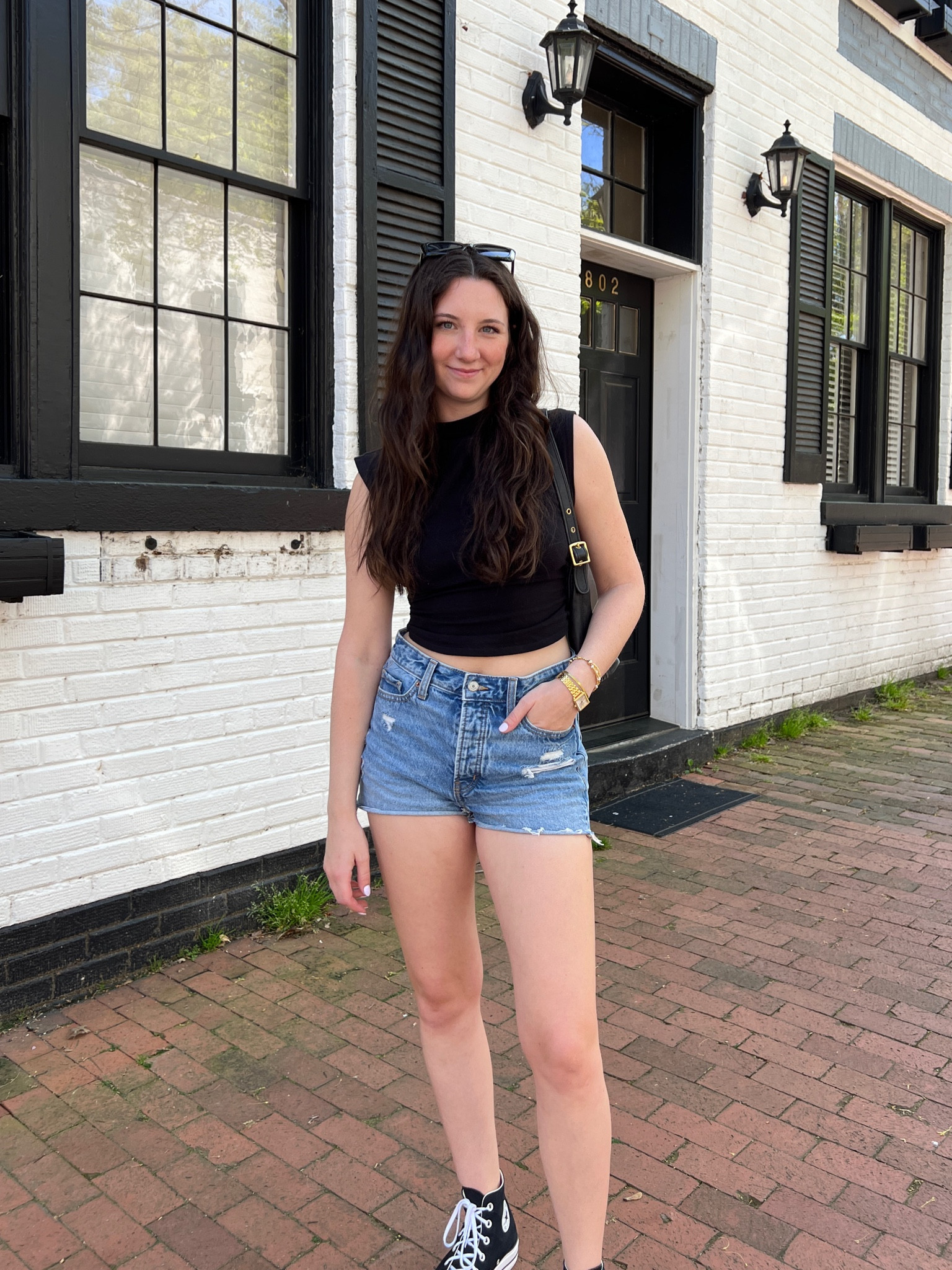 Summer day casual outfit with black top, jeans shorts, black shoulder bag, and black platform converse 

#LTKunder50 #LTKSeasonal #LTKunder100