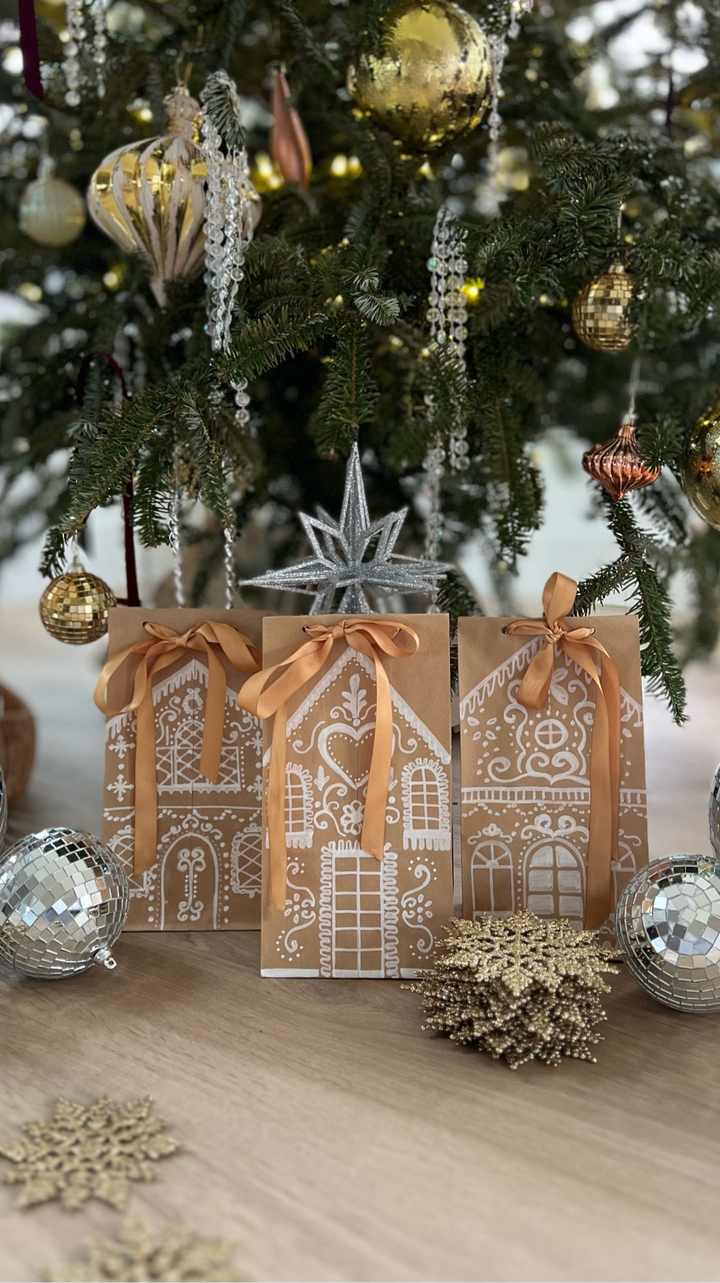 DIY Christmas Gift Bags ✨ | Turn simple brown paper bags into festive gingerbread houses with chalk markers, satin bows, and a hole punch! Perfect for that personal touch this holiday season. 

#ChristmasDIY #GiftBagIdeas #HolidayCrafts #DIYChristmas #GingerbreadDecor #HandmadeGifts #FestiveDecor #ChalkMarkerArt #Christmas2025 #SlowLivingChristmas 

#LTKHoliday #LTKGiftGuide #LTKSeasonal