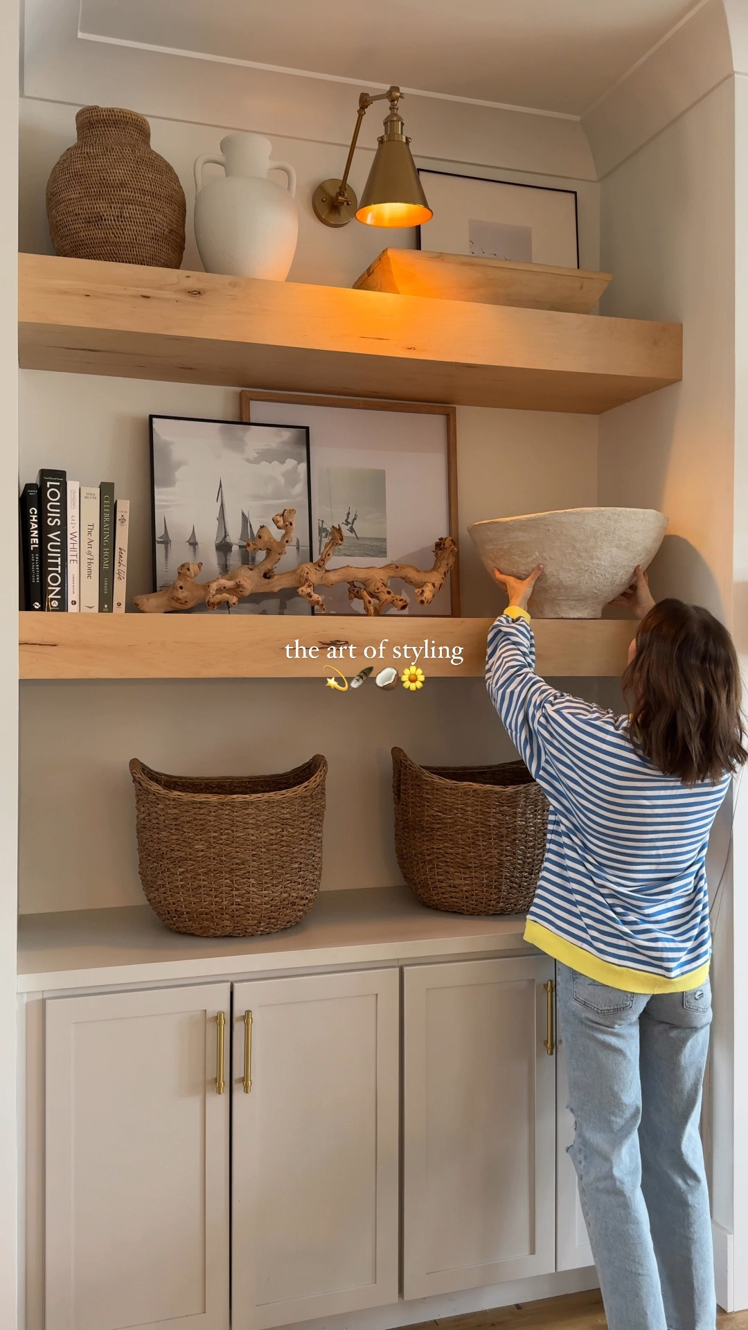 the art of styling 💫 | I think the key to a cohesive look on your shelves is to pick 1-3 colors and stick to that throughout all your items (I did white, natural wood + pops of black) large scale items fill the space without having tones of small items that may feel cluttered, use books to add height to items! 

*lots of this is collected + took weeks to style & get “just right”
save + share for styling ideas 🤭
#shelfdecor #shelfstyling #neutralhome #builtins #stylewithme #homestyling #livingroom #homegoods #livingroomdesign 

#LTKStyleTip #LTKHome #LTKFindsUnder100