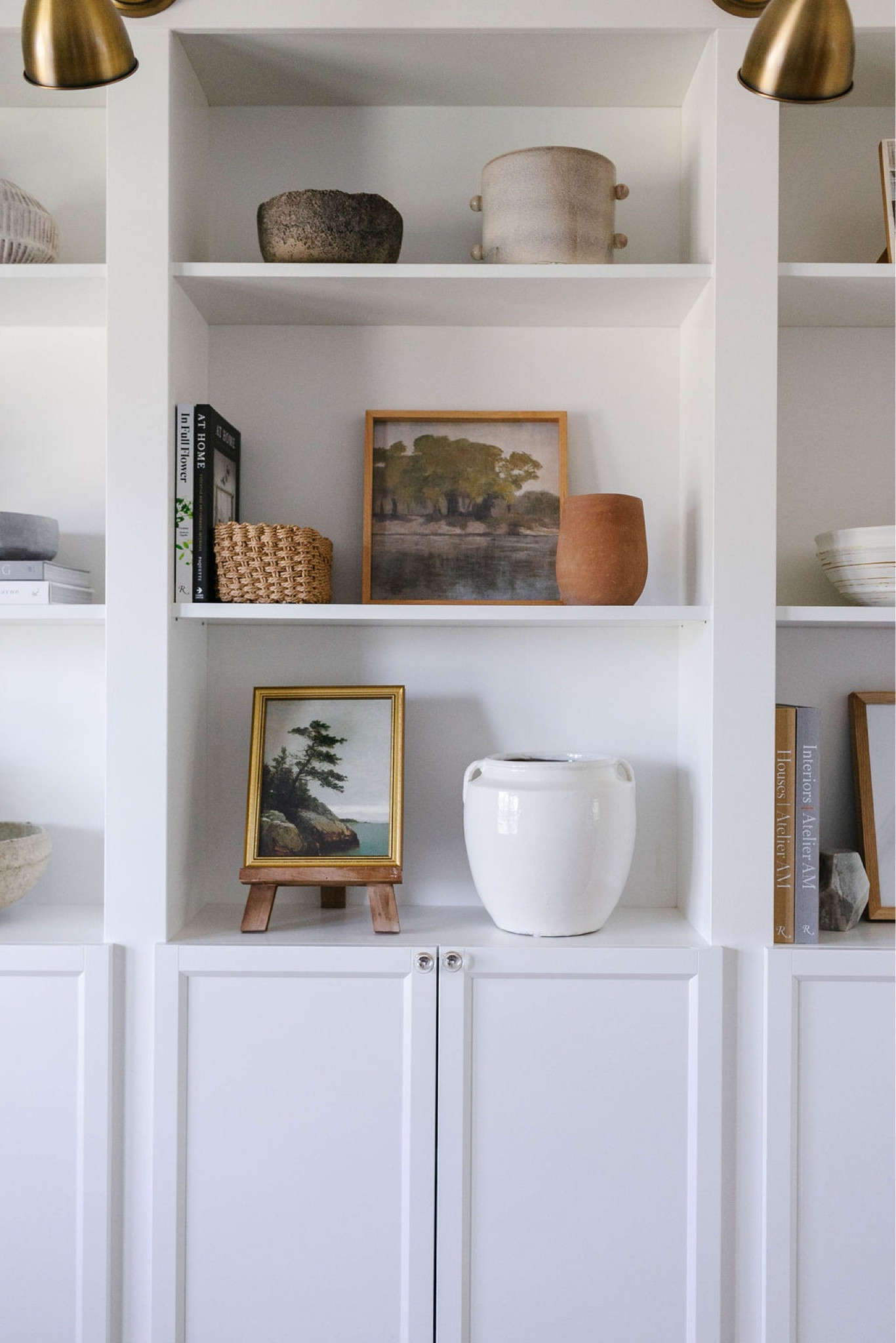 On the shelves in my home office I love to style artwork, vases, baskets, pots, coffee table books  

#LTKstyletip #LTKFind #LTKhome