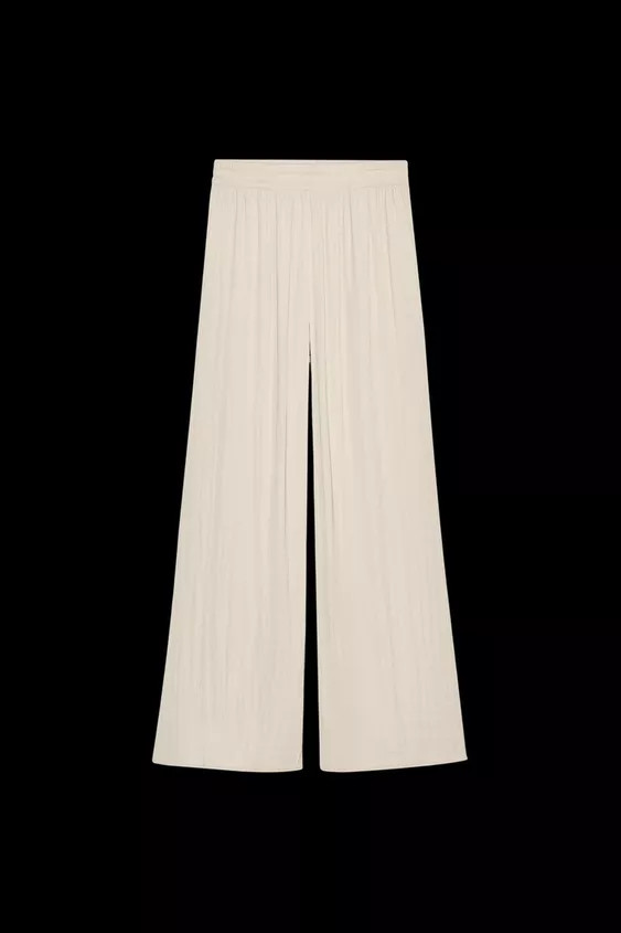 High-waisted pants with elastic waistband. Front pockets. Very wide leg. | Zara US