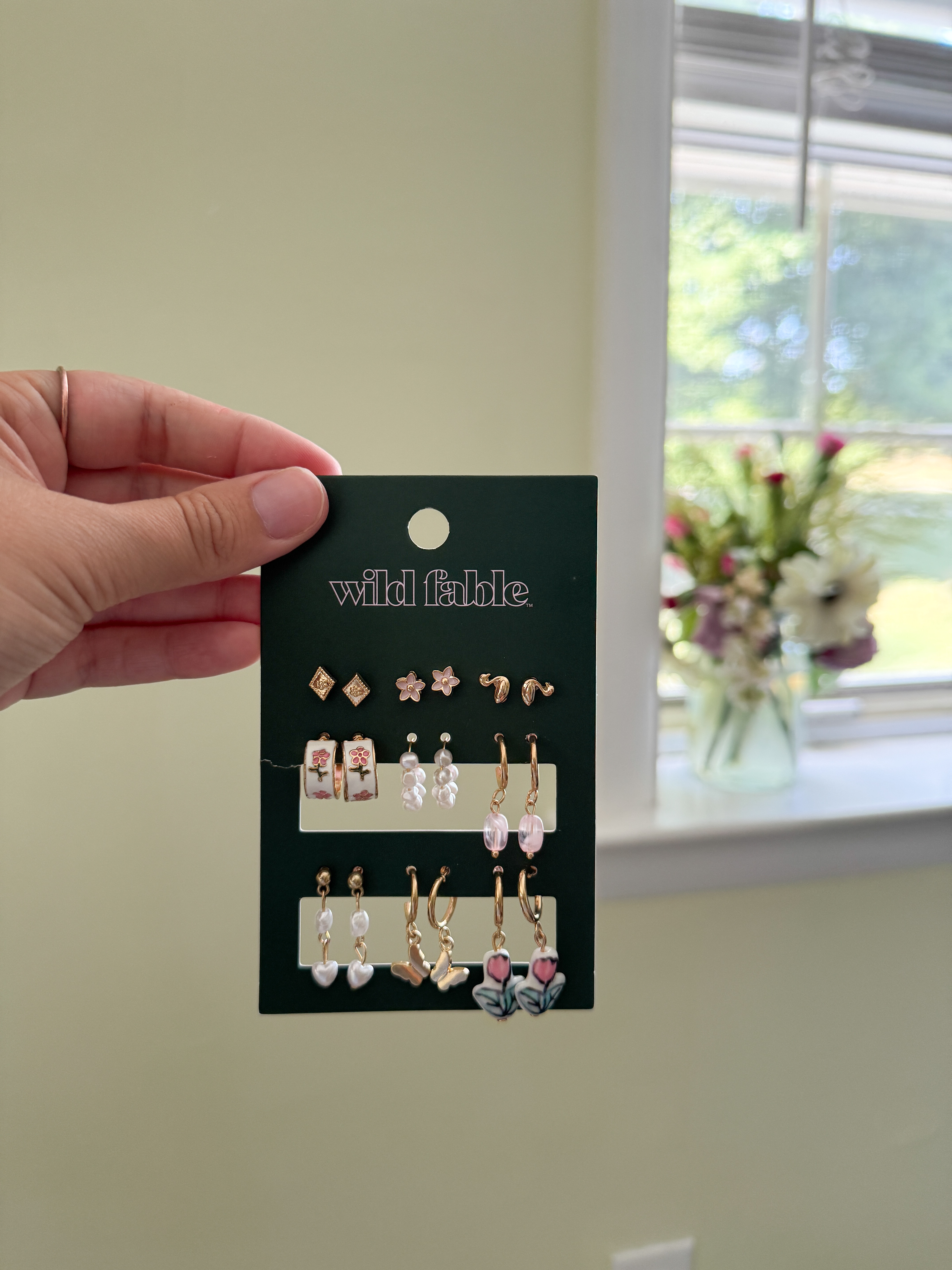 This affordable grandma earring set/stack might be one of my favorite target jewelry finds ever! You get 9 pairs, little gold studs, flower huggies, pearl drops, butterfly charms, tulip dangles, literally something for every outfit. If you're building out your earring collection without spending a fortune, these cute earrings are it! 

 #LTKootd #LTKSeasonal #LTKSaleAlert