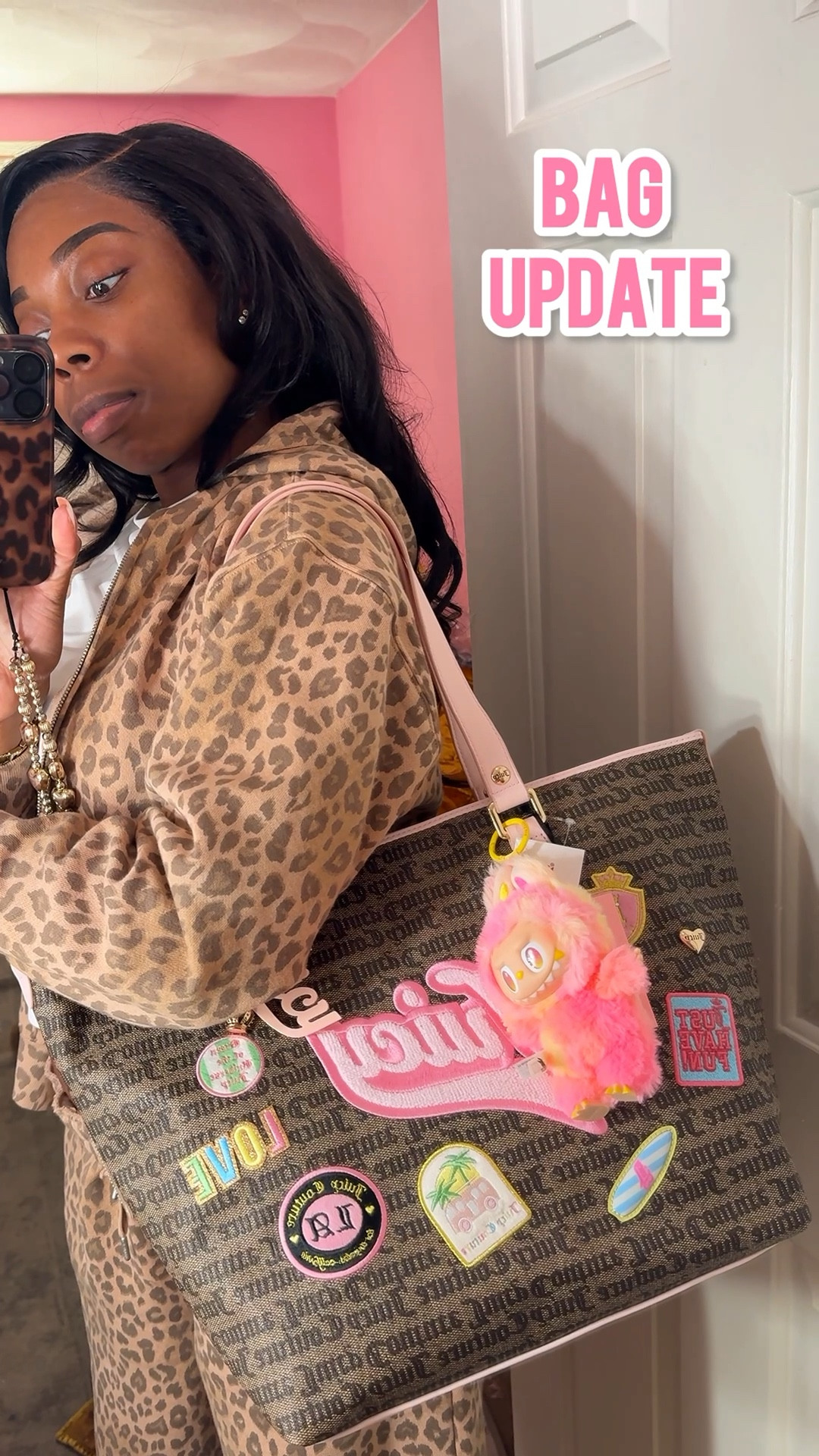 I saw this juicy couture bag in TJ Maxx in blue and brown, and I asked y’all to help me decide which color to get 👀

I got it in Brown! It’s gonna be such a cute everyday bag, and of course I got a pink labubu for it (to wear as a purse charm) 💖.

Btw, i’m wearing this leopard print Victoria’s Secret Pink sweatsui in a size small. Since I am tall (5’9”), I got the sweatpants in the longer length (which is perfect for me). 

This sweatsuit is so warm and cozy 🙏🏾😍

#LTKdayinmylife #LTKootd