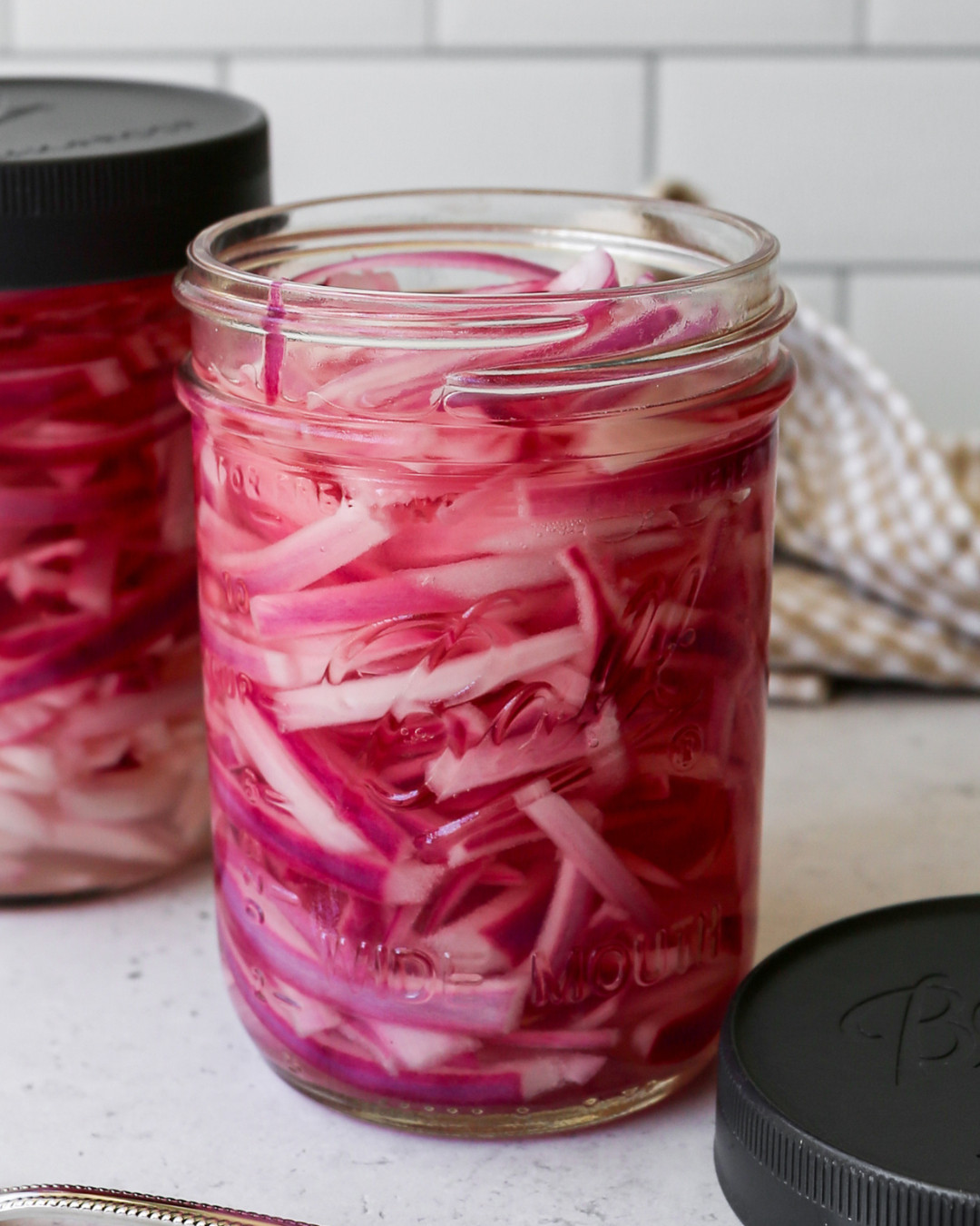 These pickled red onions are the easiest 5 ingredient recipe and I use these exact tools to make them every time.
The Ball Wide Mouth Mason Jars are the perfect size for a batch, and the Ball Leak-Proof Plastic Lids make storing and grabbing them from the fridge so easy. I whisk the brine right in the Our Place Mini Perfect Pot, measure everything out with the OXO Good Grips Angled Measuring Cup and OXO Good Grips Measuring Spoons, and give it a stir with the OXO Good Grips Wooden Utensil Set.
Shop everything I used linked in this post so you can make a jar of your own this week. 

 #LTKdayinmylife #LTKfoodie #LTKHome