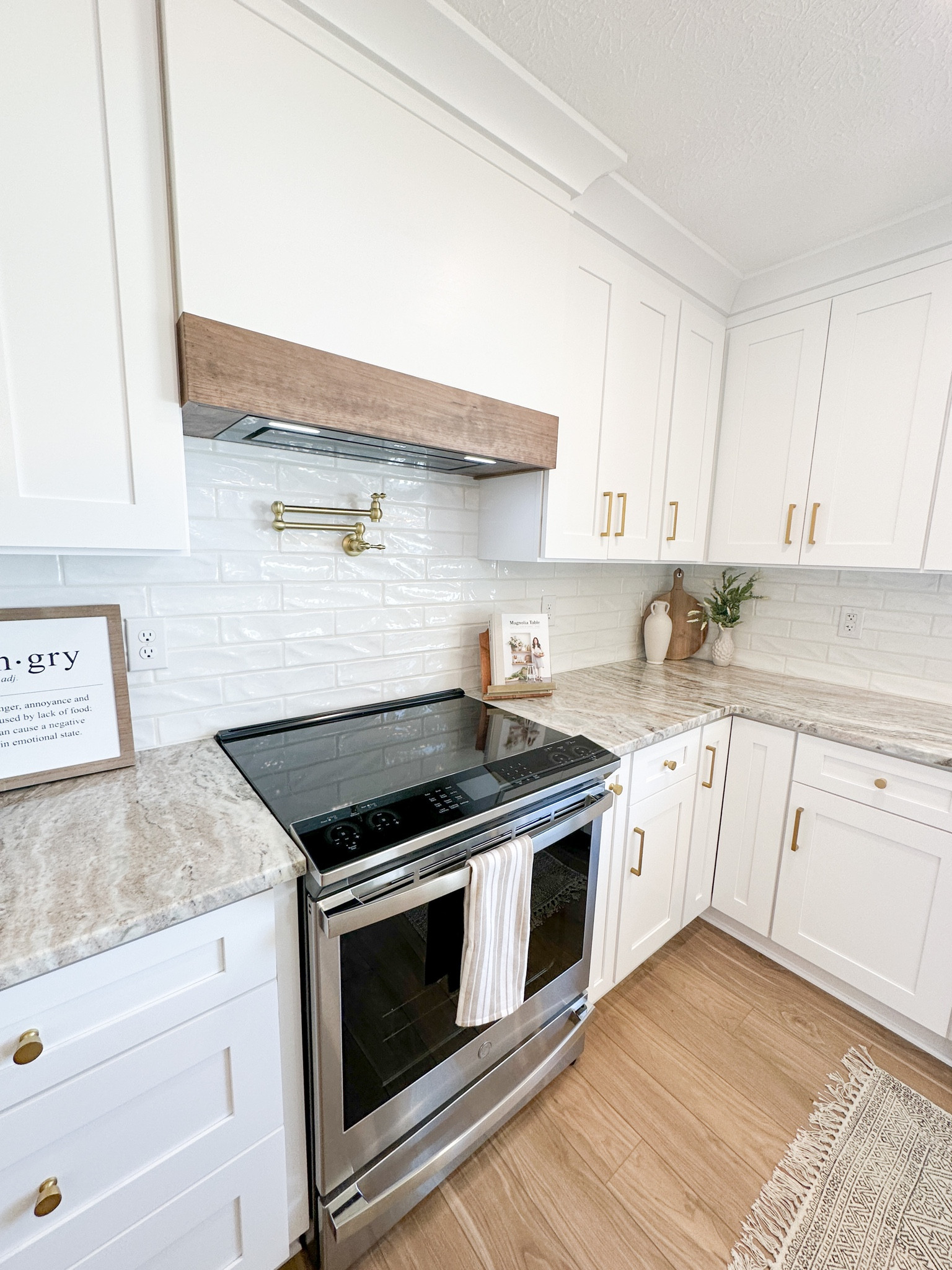 Range with hood vent // custom kitchen // pot filler // kitchen design

#LTKSeasonal #LTKunder100 #LTKhome