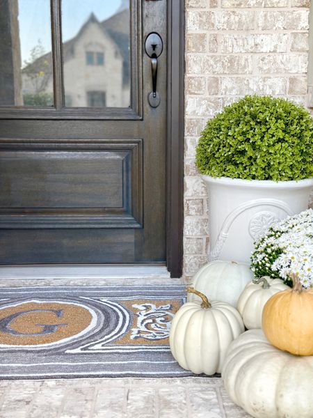 Fall front porch refresh with this beautiful monogram doormat and gorgeous  boxwood ball from @Frontgate 🍂 also linking my magnolia wreath and a  similar French inspired urn planter! ✨ #ad #Frontgate fall decor elegant home decor outdoor 

#LTKstyletip #LTKhome #LTKsalealert