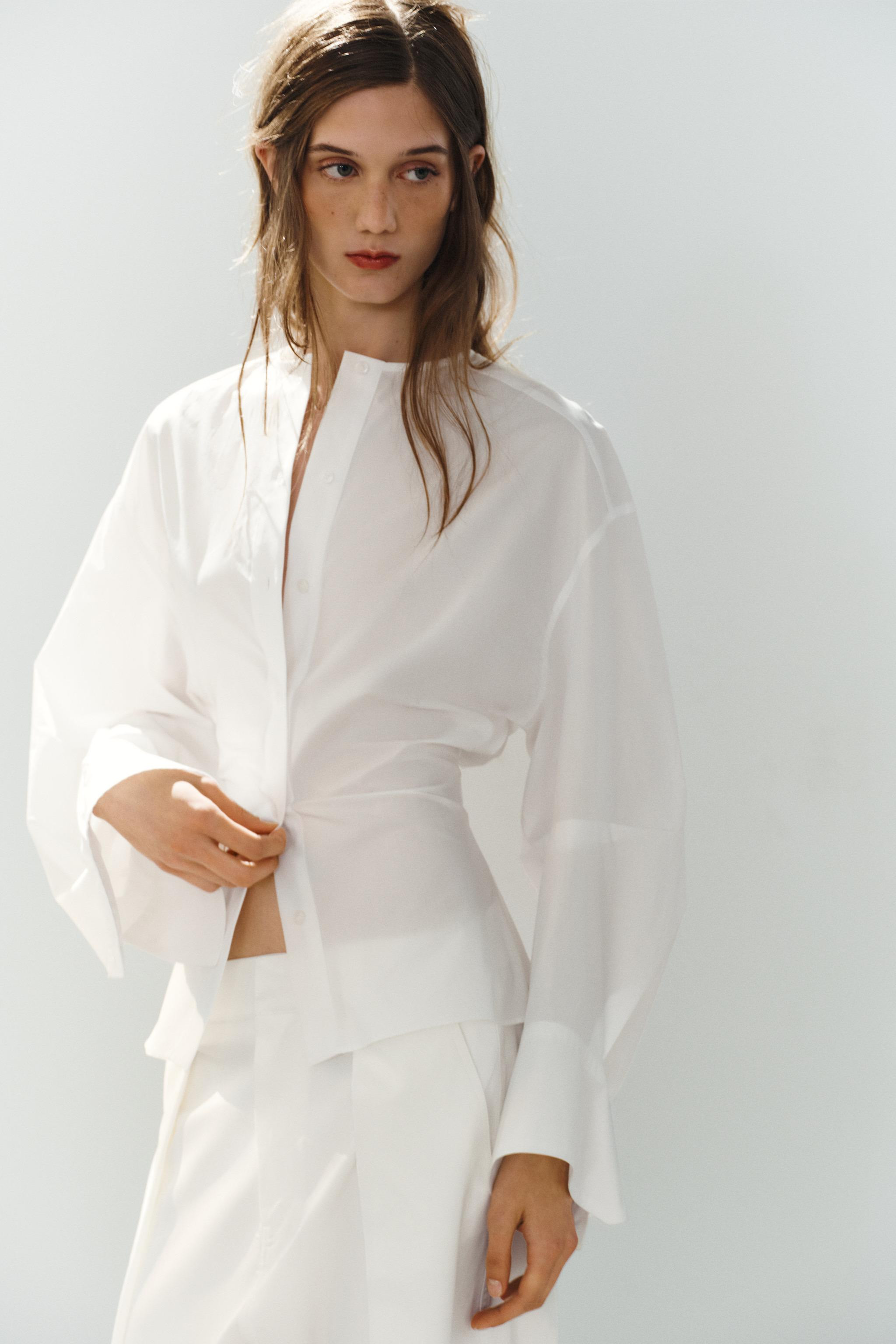Fitted shirt with a round neckline and long, voluminous sleeves with slit detail. Front button fa... | Zara US