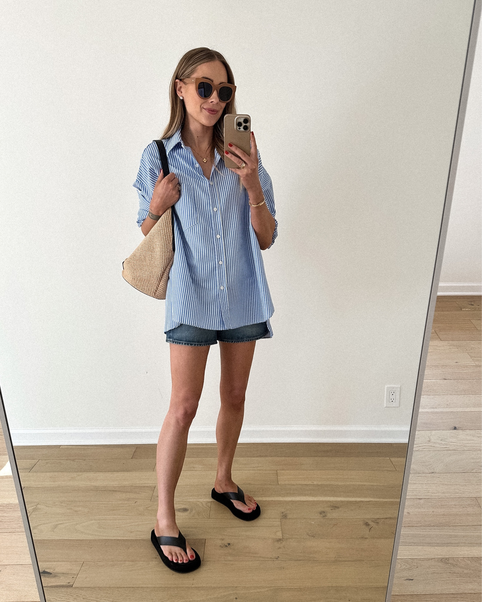 Fashion Jackson wearing blue white stripe shirt (xs/s), denim shorts, black sandals, raffia bag, summer outfit #fashionjackson #sandals #denimshorts 

#LTKunder100 #LTKstyletip #LTKshoecrush