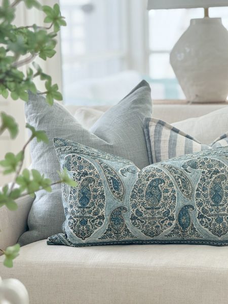 Really loving this pillow combo for spring! They’re styled with our favorite linen sofas, a blue and white striped rug, raffia coffee table, large greenery branch, and oversized white ceramic vase. Loving these blue linen pillows (color is Chambray), paisley lumbar pillow, striped pillows, and more! See our full spring tour here: https://lifeonvirginiastreet.com/2024-spring-home-tour/.
.
#ltkhome #ltksalealert #ltkseasonal #ltkfindsunder50 #ltkfindsunder100 #ltkstyletip spring decor, spring living room, coastal decor, 

#LTKsalealert #LTKSeasonal #LTKhome