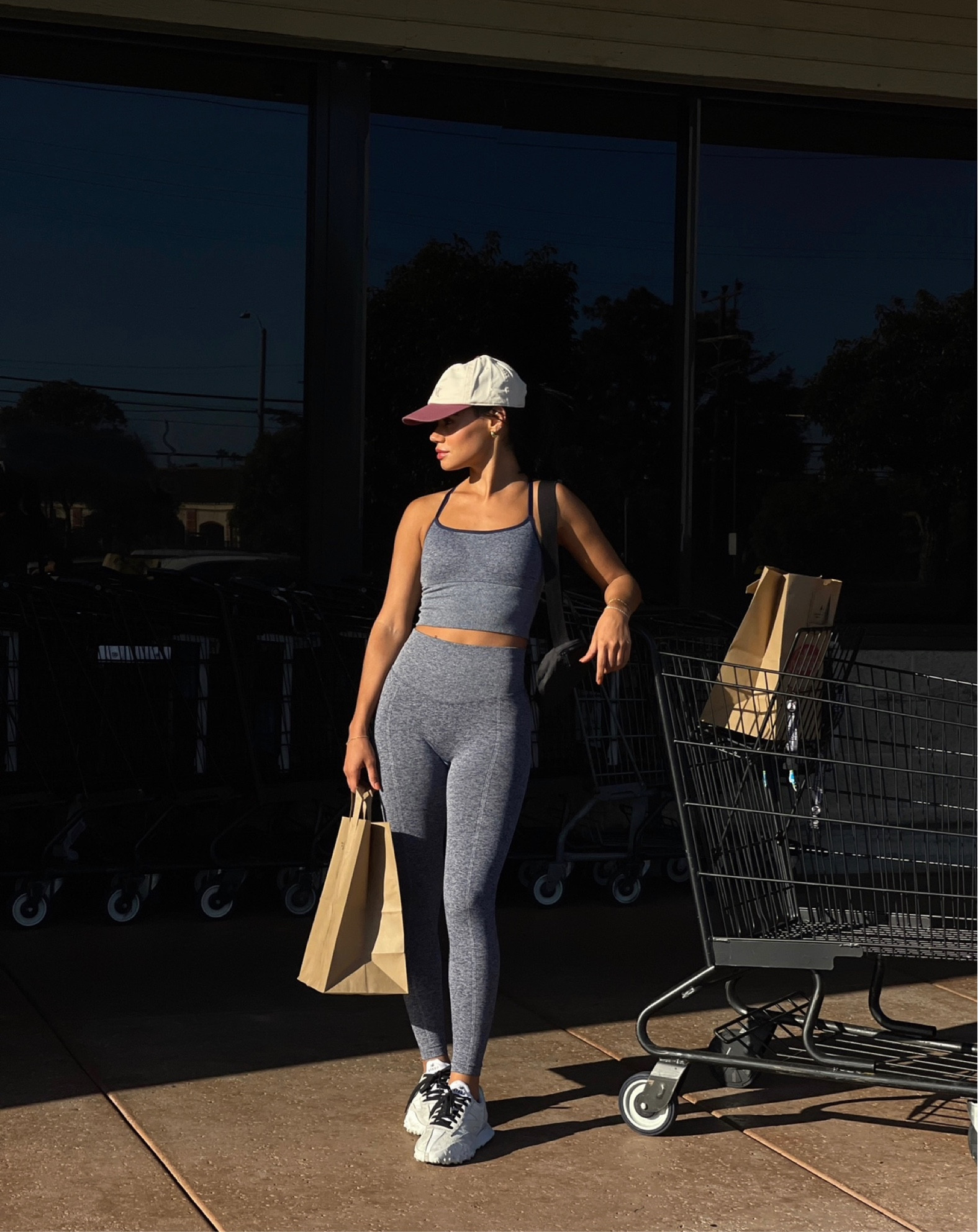 pink Victoria’s Secret blue sports bra and leggings, basketball cap + new balance sneakers #newbalance #victoriassecret 

#LTKstyletip #LTKSeasonal #LTKshoecrush