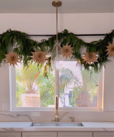 I used the viral hanging garland trend using a curtain rod and added some paper stars to finalize the look.

Holiday Christmas green garland hanging decor home decor Amazon home finds holiday decor paper starts neutral decor

#LTKhome #LTKHoliday #LTKfindsunder100