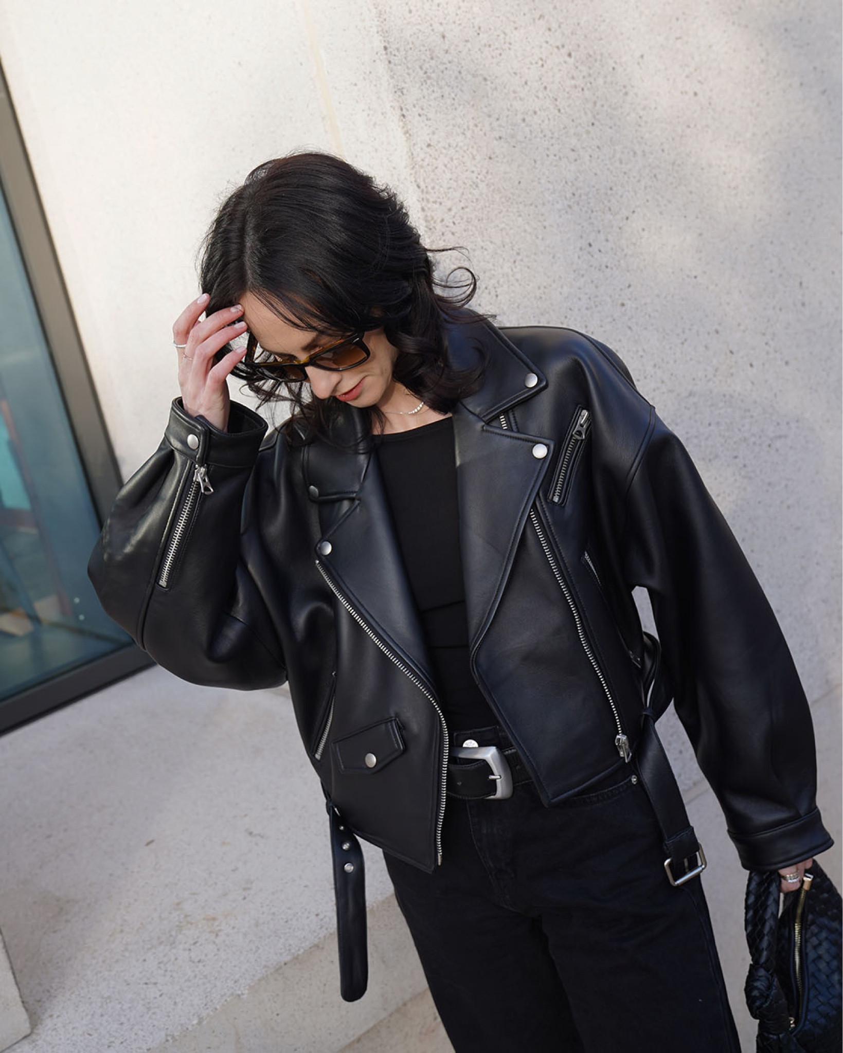 leather blazer by ducie alternative by whistles 
off the shoulder top by arket 
chelsea boots by ganni 
belt by khaite alternative by arket 
wide leg jeans by na-kd alternative by monki 
sunglasses by Rayban 
bag (bottega dupe) by anthropologie 
all black outfit 
leather jacket style 

#LTKstyletip #LTKSeasonal #LTKeurope