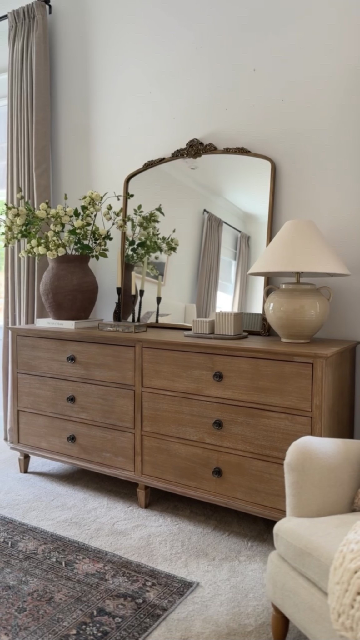Our top selling primary bedroom dresser! Love the warm styling details of the lamp, vase, and pretty mirror!

#LTKFindsUnder50 #LTKHome #LTKSeasonal