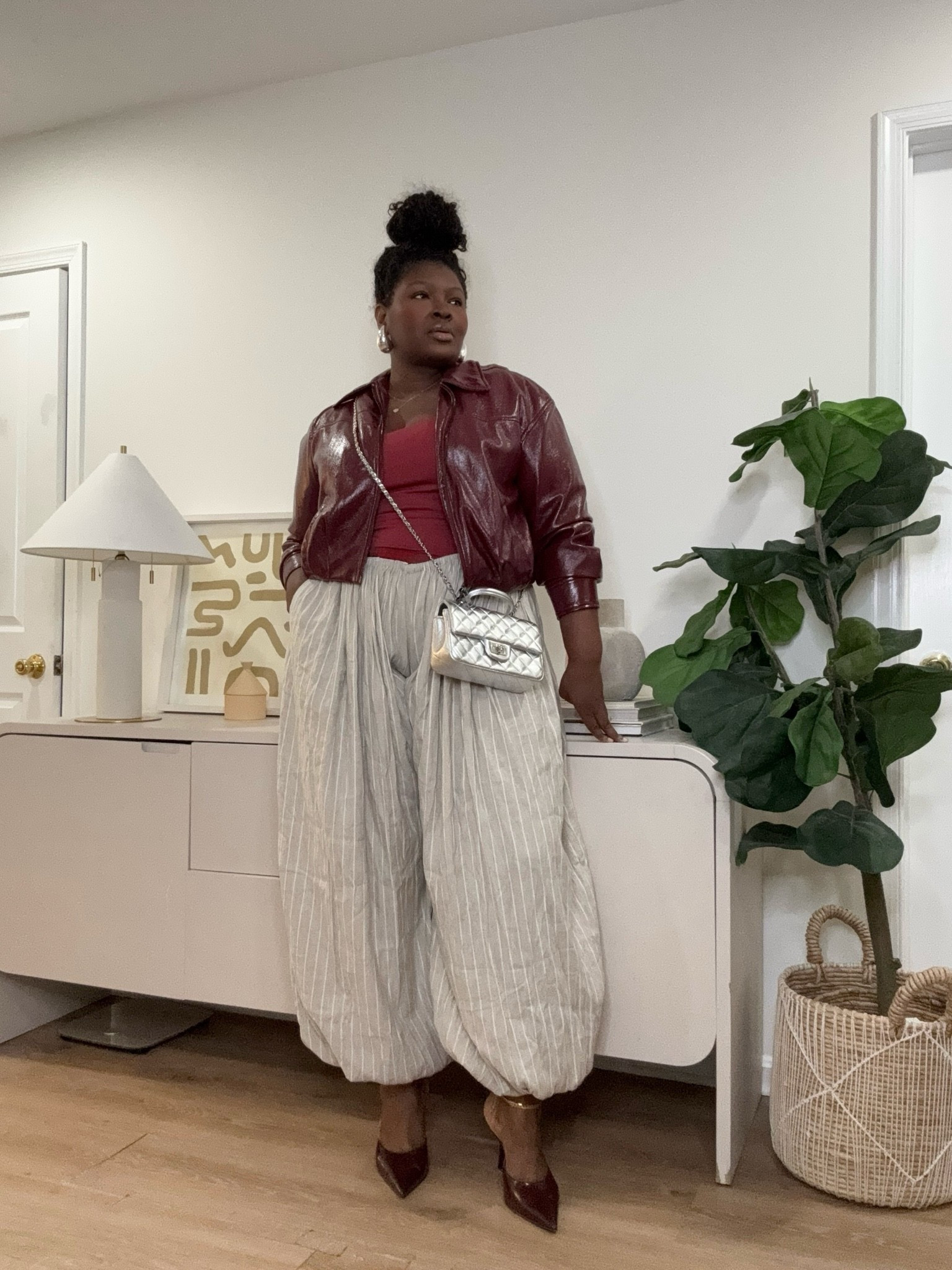 Some fall outfits just get the color combination right. Burgundy, cream, and a little shine come together here for a look that feels polished while the relaxed pants keep it comfortable.   burgundy fall outfit, cream pants outfit, leather jacket outfit, fall outfit ideas, plus size fall fashion, curvy fall style, casual chic outfit

#LTKootd #LTKSeasonal #LTKMidsize
