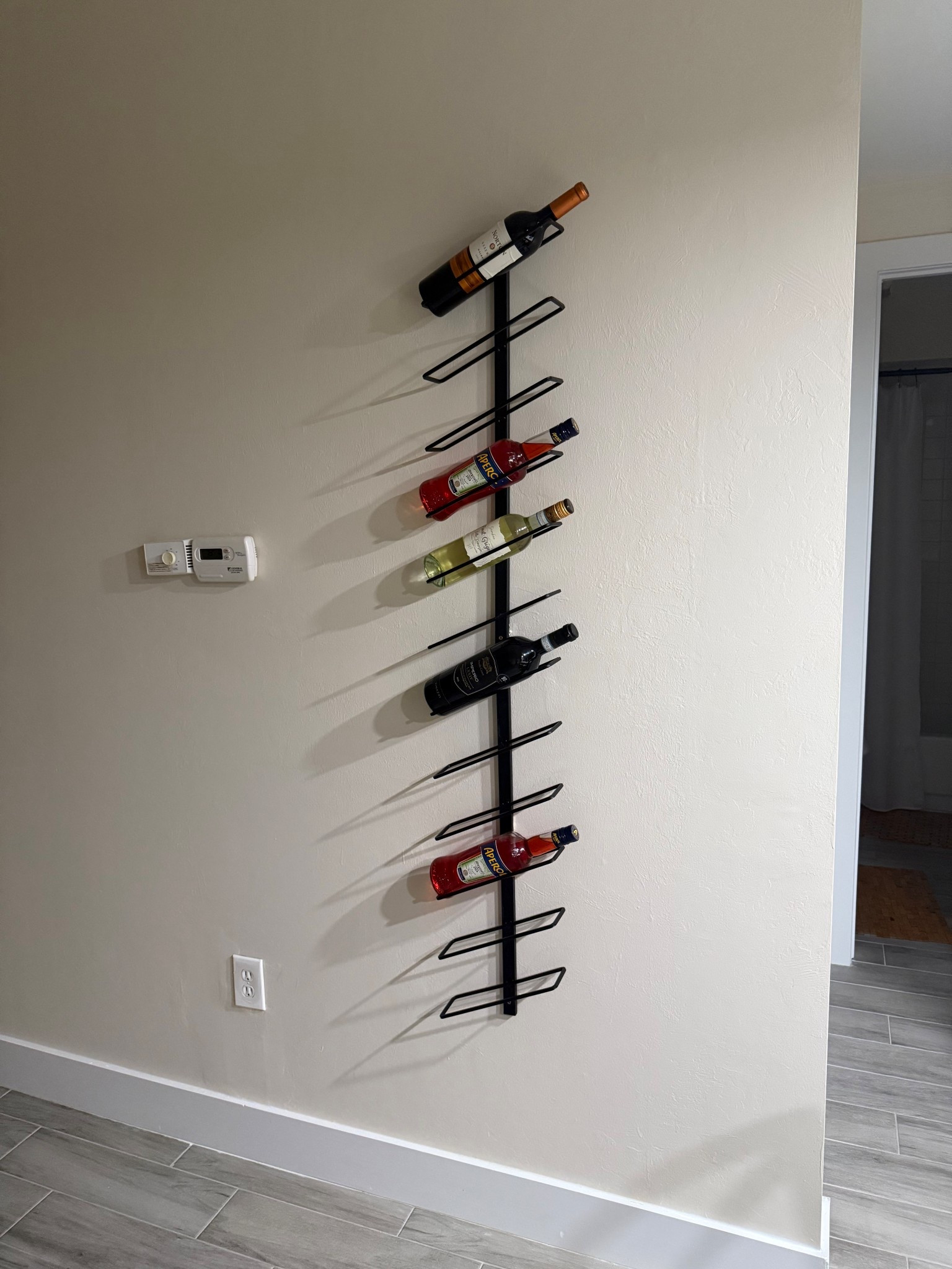 Small apartment , affordable easy to hang aesthetic modern wine rack 

#LTKHome #LTKSpringSale #LTKStyleTip