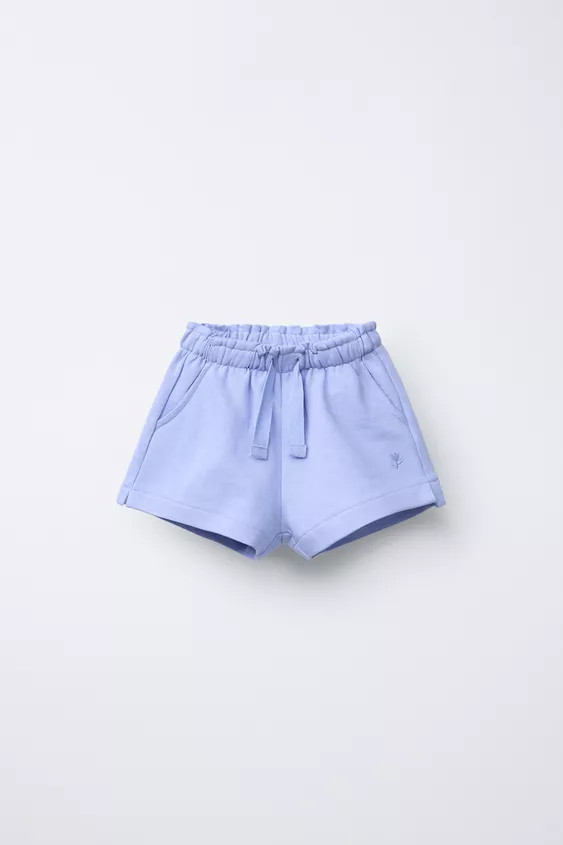 Plush shorts with elastic waistband and front drawstring. Front pockets and embroidered flower de... | Zara US