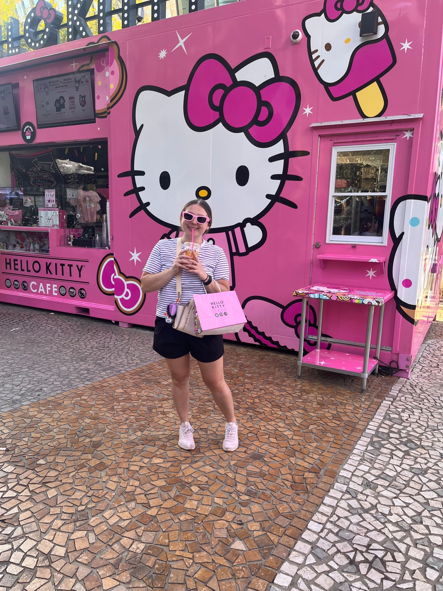 ✨Childhood dreams = COMPLETE✨ 

Finally made it to the Hello Kitty Cafe Las Vegas and my inner kid is thriving! 💕☕️🎀 

Sipping the cutest peach tea in front of the pinkest Hello Kitty truck, rocking my casual summer outfit, striped tee, black shorts, pink sneakers, and crossbody bag for the perfect Vegas day. 💖 

If you love kawaii vibes, pink aesthetic, and Sanrio nostalgia, this is your must-visit Vegas dessert cafe and ultimate Instagram photo spot. 🍰🧁🌸 

#HelloKittyCafe #LasVegasFoodie #KawaiiStyle #PinkVibes #LTKStyle #LTKUnder50 #VegasItinerary #HelloKittyLover #CuteCafeGoals #LTKFinds #HelloKittyForever #SanrioStyle #LTKOutfit #OOTD

#LTKFindsUnder50 #LTKTravel #LTKSeasonal