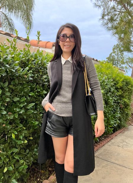I wore this grey and black outfit back when it was still raining! It’s an updated version of my fail proof combo: collar top underneath a cashmere sweater with leather shorts. I layered it with a long sleeveless duster and knee high boots. 

#kneehighboots #cashmeresweater #leathershorts 

#LTKshoecrush #LTKstyletip