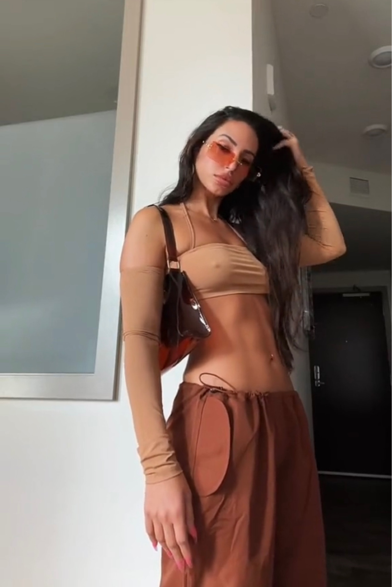 Definitely wearing this top for different occasions. I got it in brown and black 🥰 Styling here with the brown low waist baggy cargo pants and Chanel inspired sunglasses. Can you believe this whole outfit costs $53 😍🤤

#LTKSeasonal #LTKstyletip #LTKunder50