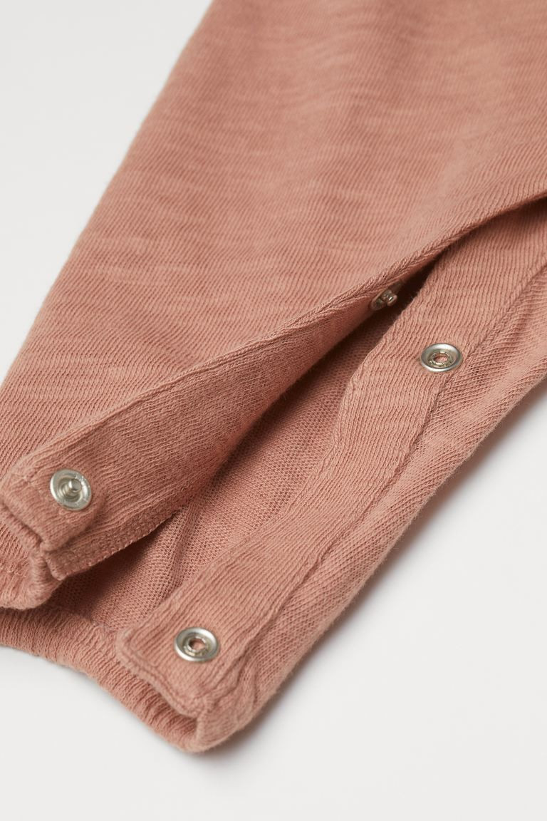 Baby Exclusive. Romper suit in soft, slub jersey made from organic cotton. Buttons at front, flut... | H&M (US + CA)