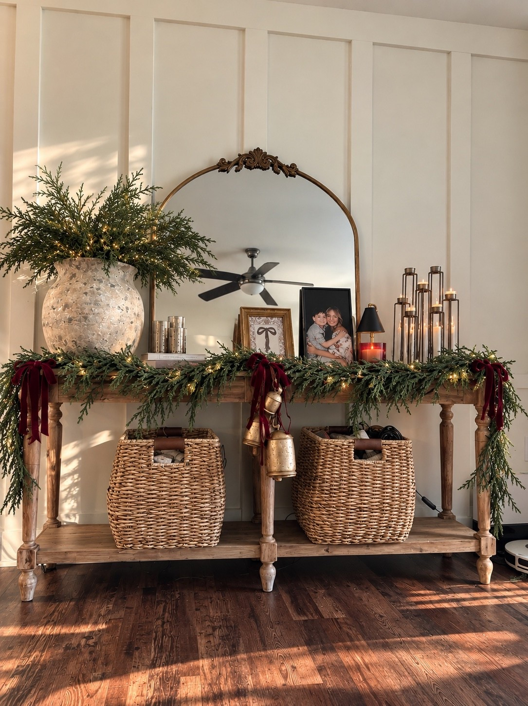 Cozy Christmas details with all the texture 🎄🤎 Fresh-looking cedar, warm twinkle lights, vintage-inspired bells and deep burgundy velvet ribbon give this little corner such a collected holiday feel. I love Christmas decor that feels natural, cozy and a little imperfect. Linking all the finds to recreate the look! ✨

#ChristmasDecor #ChristmasHome #HolidayDecor #LTKHome #ChristmasInspo