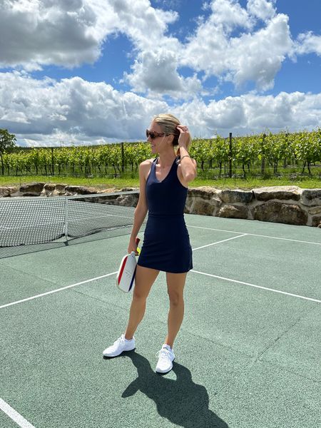 Love this tennis dress or pickleball dress that has built in shorts! I also linked the white tennis dress I have by the brand as well. Perfect for the summer heat! #ad

#LTKFitness #LTKActive