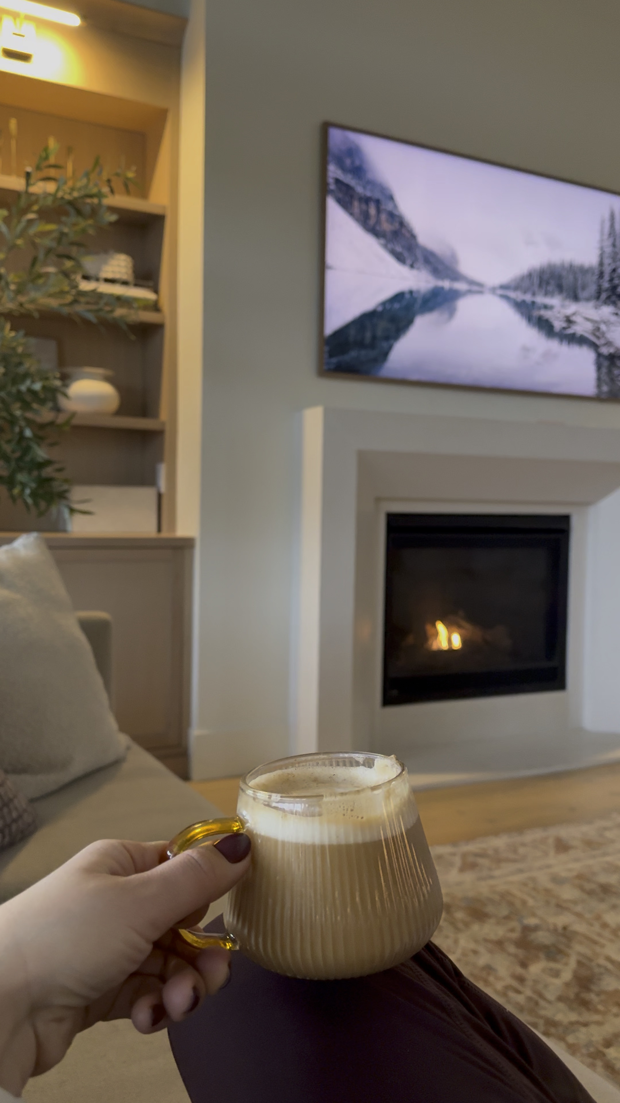 Enjoying my morning coffee by the fire .for those of you asking I’ve linked my coffee mugs that make any drink feel fancy ;) I’ve linked other things like my frame tv currently 40% off at Target , some decor pieces and my stunning olive tree . 

#LTKStyleTip #LTKHome #LTKWatchNow