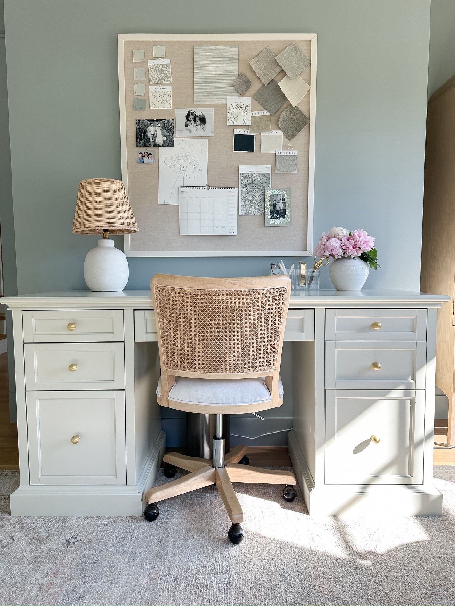 Coastal and cozy home office, Boothbay gray paint, cane & linen office chair, off white executive desk, gold knobs 

#LTKStyleTip #LTKFindsUnder100 #LTKHome